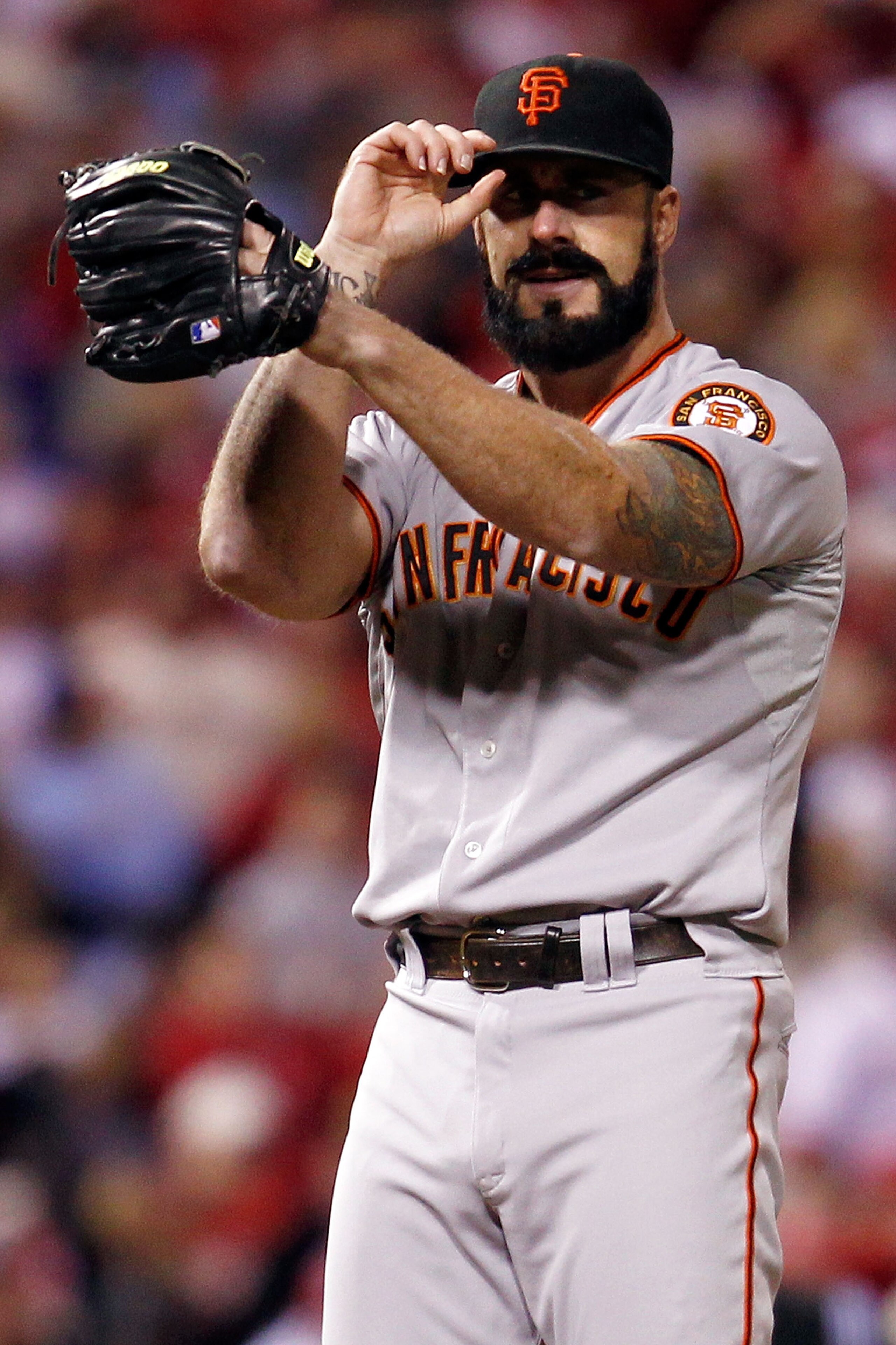 PHILADELPHIA - OCTOBER 16:  Brian Wilson #38 of the San Francisco Giants looks on against the Philadelphia Phillies in Game One of the NLCS during the 2010 MLB Playoffs at Citizens Bank Park on October 16, 2010 in Philadelphia, Pennsylvania.  (Photo by Je