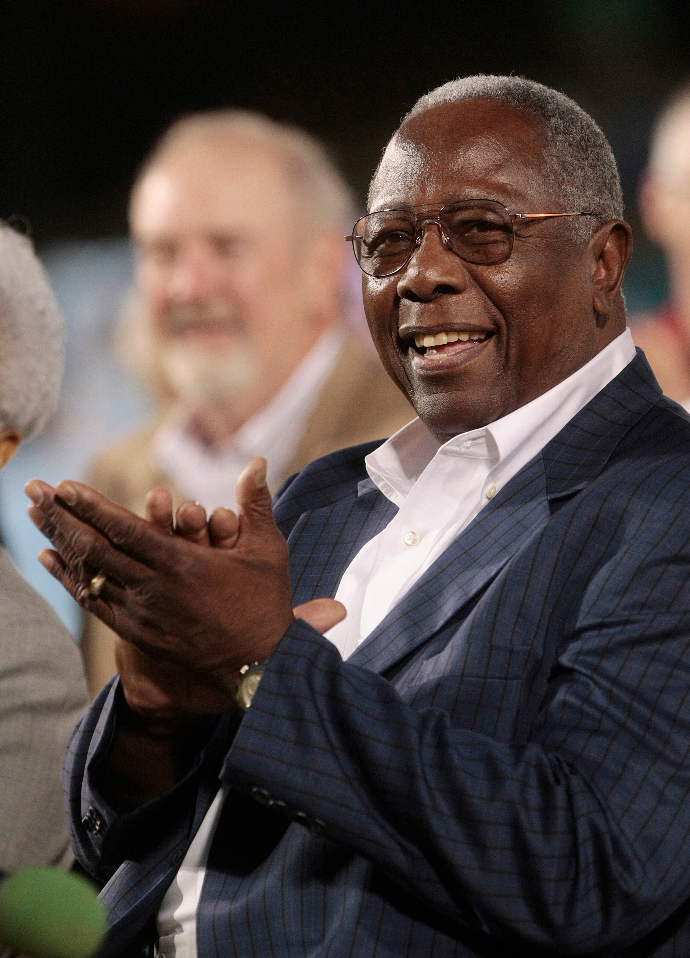 MOBILE, AL - APRIL 14: Baseball Hall of Famer Hank Aaron applauds during pre-game ceremonies following the opening the Hank Aaron Museum at the Hank Aaron Stadium on April 14, 2010 in Mobile, Alabama. (Photo by Dave Martin/Getty Images)