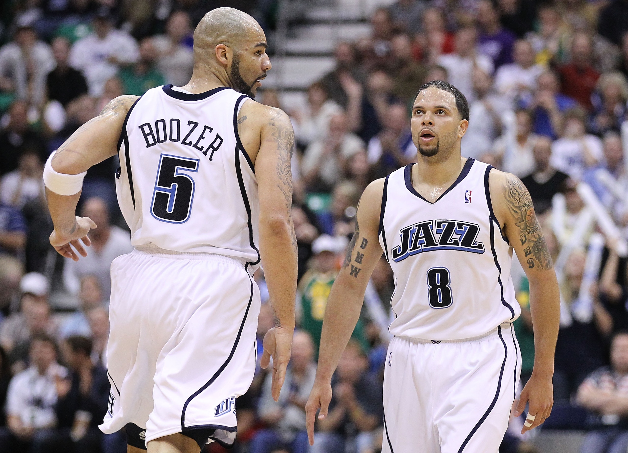 SALT LAKE CITY - MAY 10:  Deron Williams #8 and Carlos Boozer #5 of the Utah Jazz look on against the Los Angeles Lakers during Game Four of the Western Conference Semifinals of the 2010 NBA Playoffs on May 10, 2010 at Energy Solutions Arena in Salt Lake