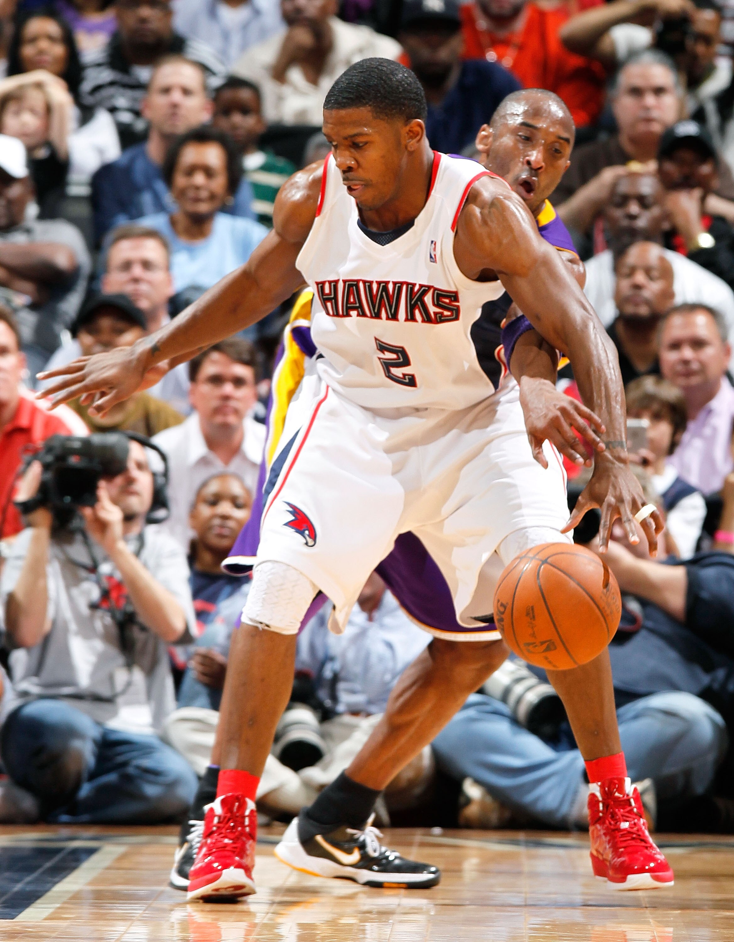 ATLANTA - MARCH 31:  Kobe Bryant #24 of the Los Angeles Lakers strips the ball from Joe Johnson #2 of the Atlanta Hawks at Philips Arena on March 31, 2010 in Atlanta, Georgia.  NOTE TO USER: User expressly acknowledges and agrees that, by downloading and/