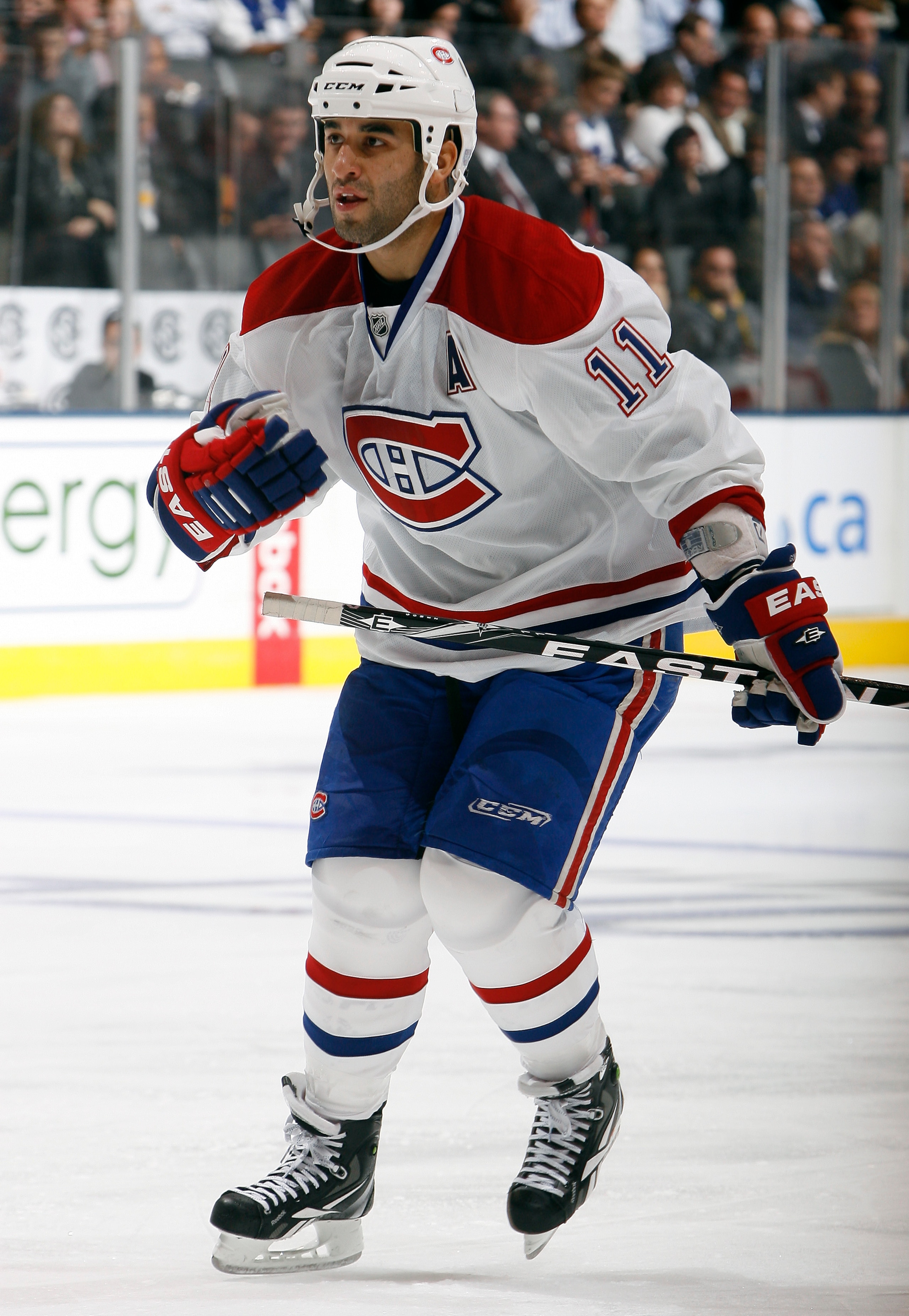 TORONTO, CANADA - OCTOBER 07: Scott Gomez #11 of the Montreal Canadiens skates up the ice during a regular season NHL game against the Toronto Maple Leafs at the Air Canada Centre October 7, 2010 in Toronto, Ontario, Canada. (Photo by Abelimages/Getty Ima