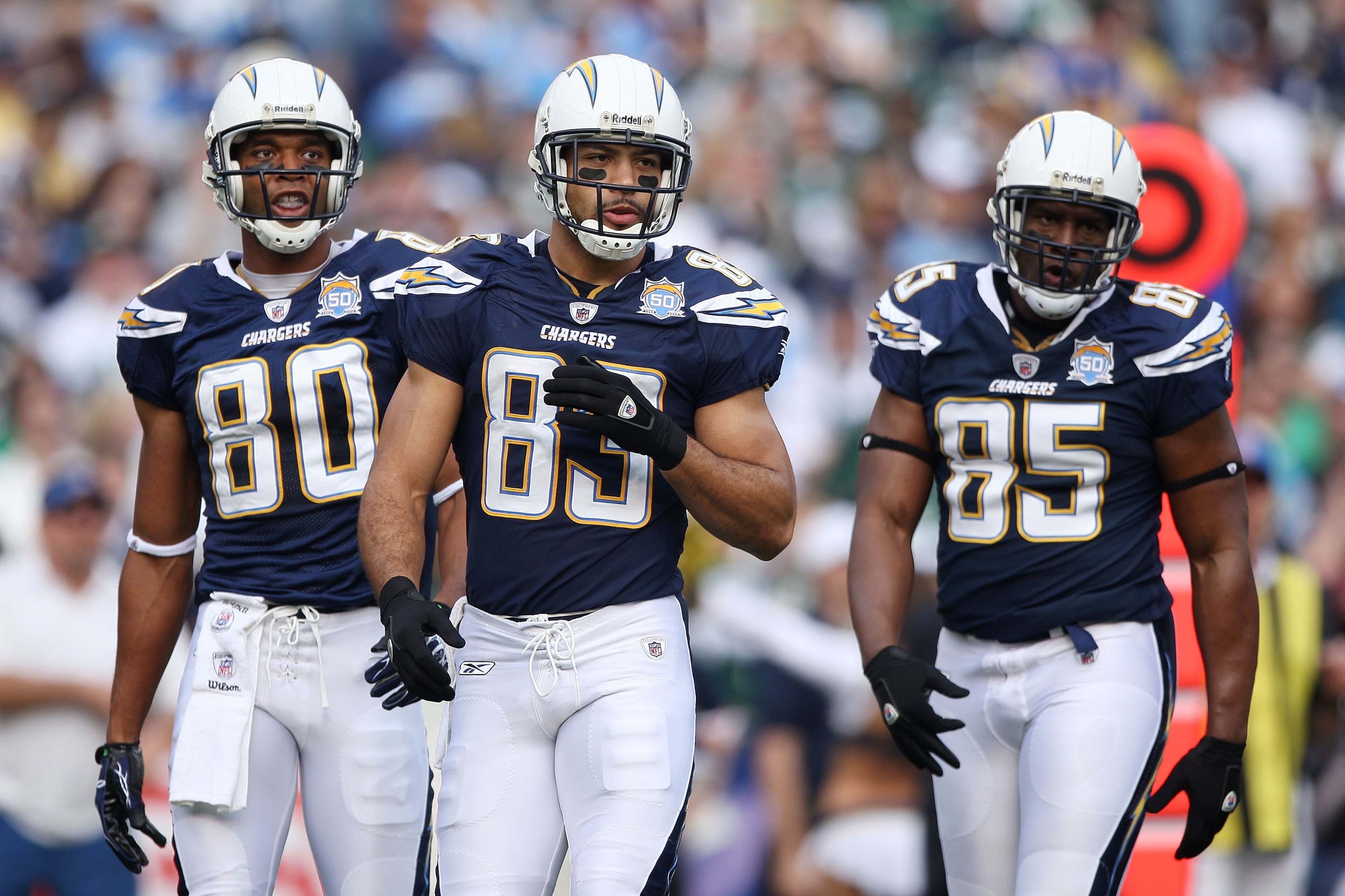 SAN DIEGO - JANUARY 17:  Malcom Floyd #80, Vincent Jackson #83 and Antonio Gates #85 of the San Diego Chargers walk on the field during the AFC Divisional Playoff Game against the New York Jets at Qualcomm Stadium on January 17, 2010 in San Diego, Califor