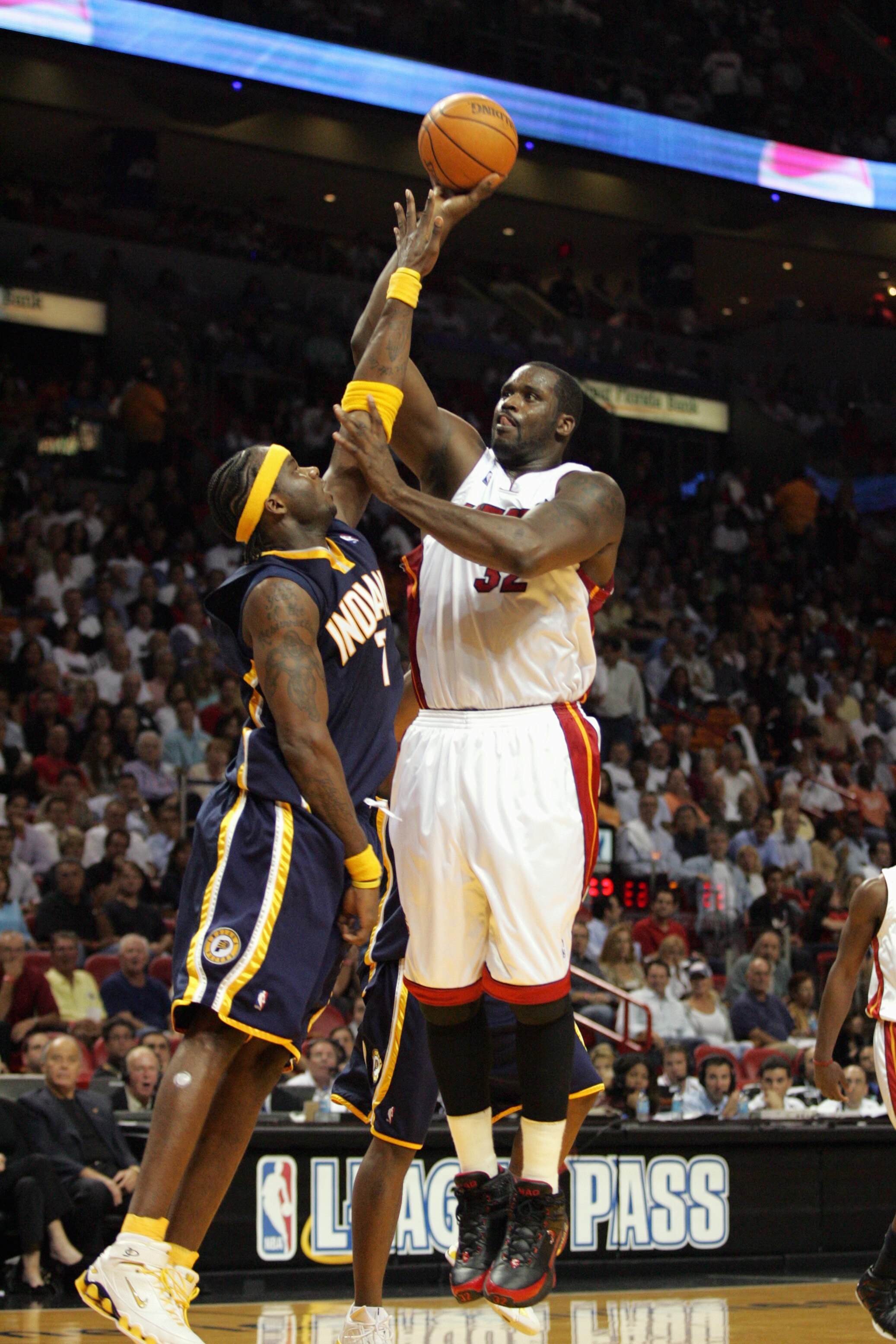 MIAMI - NOVEMBER 3:  Shaquille O'Neal #32 of the Miami Heat shoots over Jermaine O'Neal #7 of the Indiana Pacers during a game at American Airlines Arena November 3, 2005 in Miami, Florida.  The Pacers won 105-102.  (Photo by Doug Benc/Getty Images)