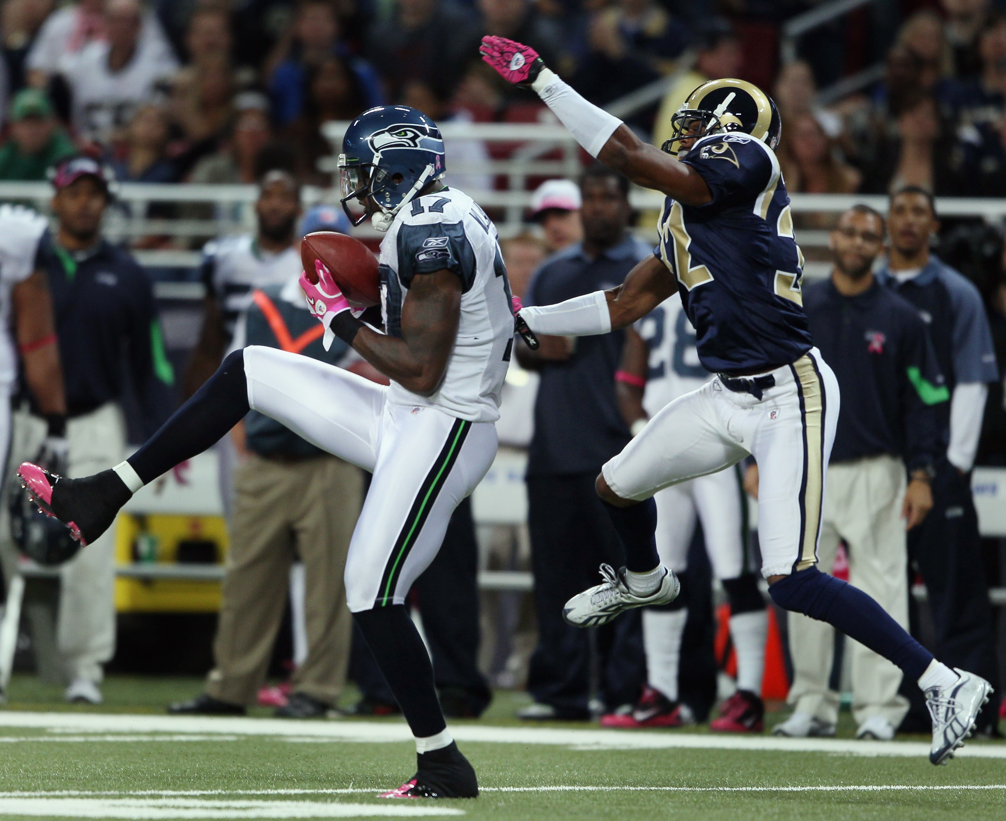 ST. LOUIS - OCTOBER 03:  Mike Williams #17 of the Seattle Seahawks makes the catch as Bradley Fletcher #32 of the St. Louis Rams defends on October 3, 2010 at Edward Jones Dome in St. Louis, Missouri.  (Photo by Elsa/Getty Images)