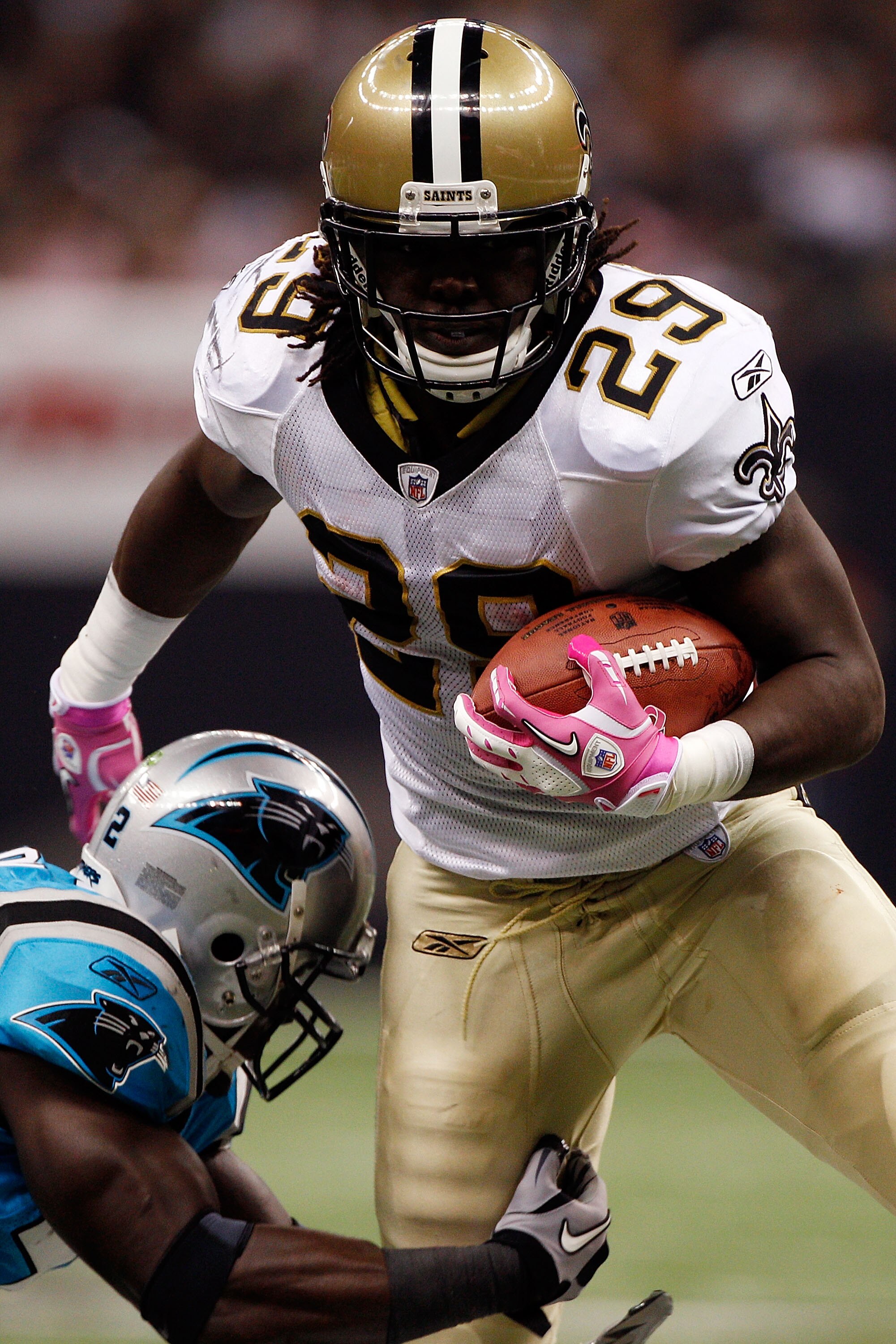 NEW ORLEANS - OCTOBER 03:  Chris Ivory #29 of the New Orleans Saints is tackled by Jon Beason #52 of the Carolina Panthers at the Louisiana Superdome on October 3, 2010 in New Orleans, Louisiana. The Saints defeated the Panthers 16-14.    (Photo by Chris