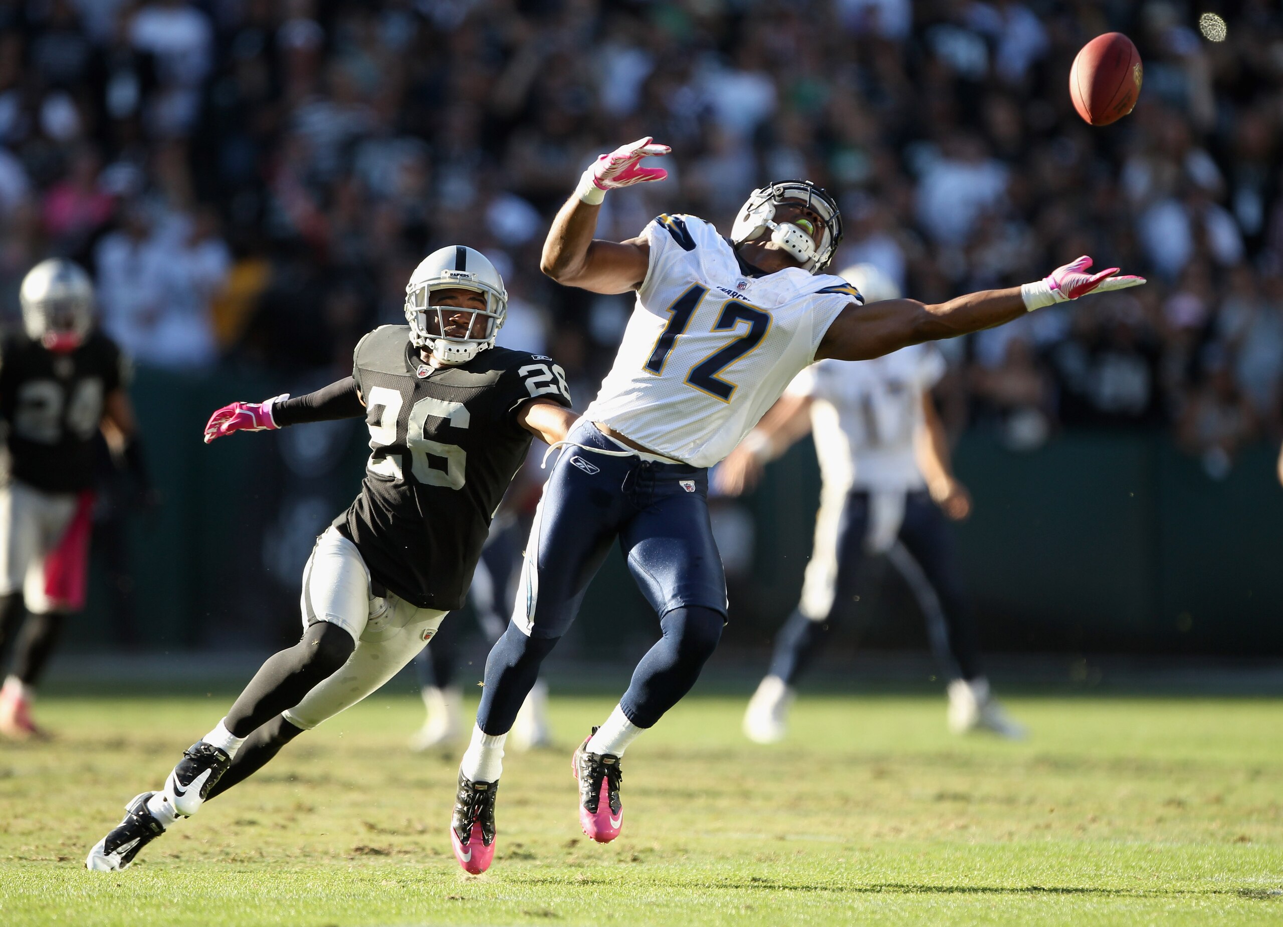 OAKLAND, CA - OCTOBER 10: Patrick Crayton #12 of the San Diego Chargers can't reach a ball while defended by Stanford Routt #26 of the Oakland Raiders at Oakland-Alameda County Coliseum on October 10, 2010 in Oakland, California. (Photo by Ezra Shaw/Get OAKLAND, CA - OCTOBER 10: Patrick Crayton #12 of the San Diego Chargers can't reach a ball while defended by Stanford Routt #26 of the Oakland Raiders at Oakland-Alameda County Coliseum on October 10, 2010 in Oakland, California. (Photo by Ezra Shaw/Get