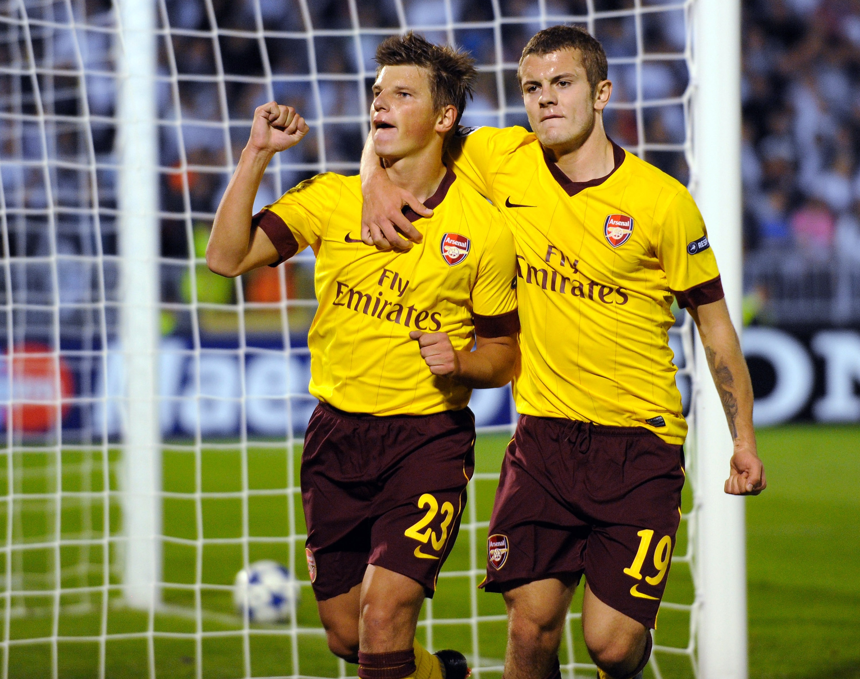 BELGRADE, SERBIA - SEPTEMBER 28: Andrey Arshavin of Arsenal (L) celebrates scoring his team's first goal with Jack Wilshere during the UEFA Champions League Group H match between FK Partizan and Arsenal at the Partizan Stadium on September 28, 2010 in Bel
