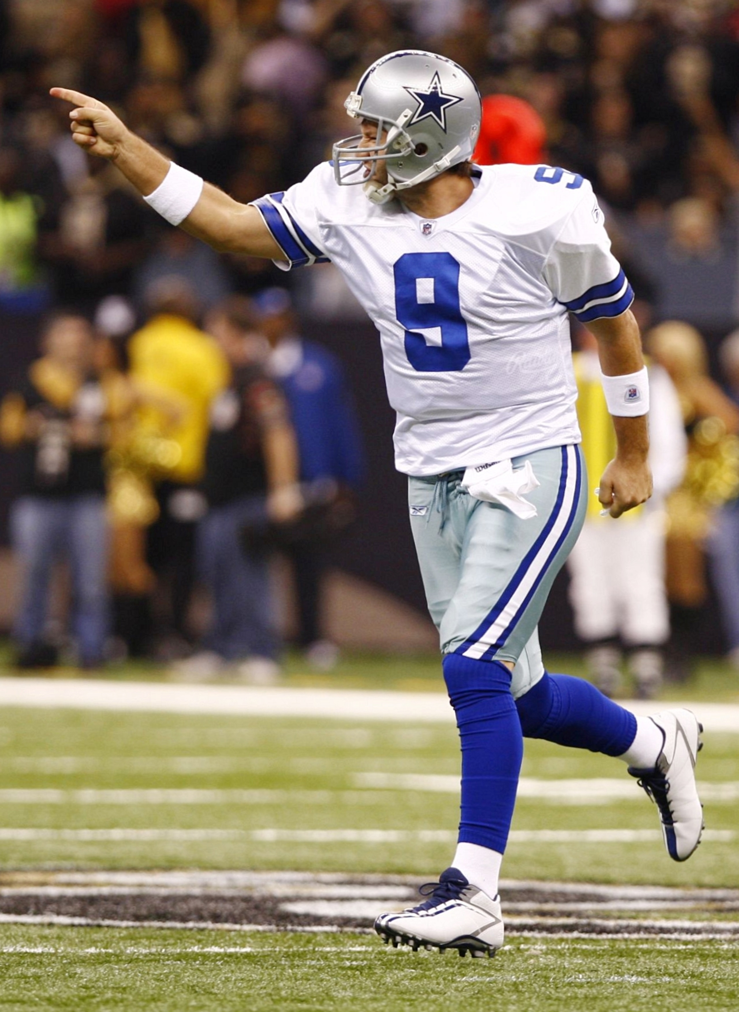 NEW ORLEANS - DECEMBER 19:  Quarterback Tony Romo #9 of the Dallas Cowboys celebrates after throwing a touchdown against the New Orleans Saints at the Louisiana Superdome on December 19, 2009 in New Orleans, Louisiana. (Photo by Scott Halleran/Getty Image