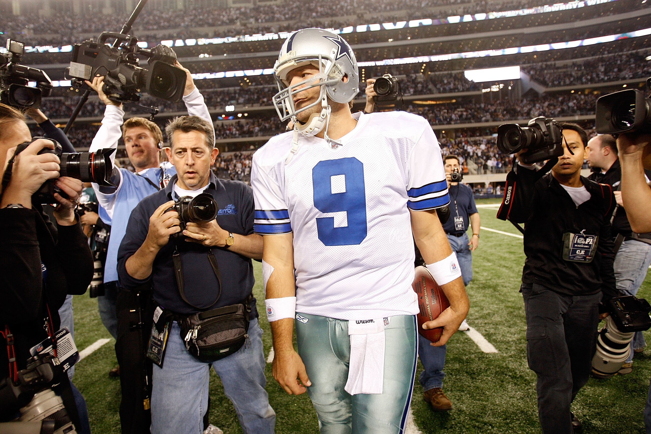 ARLINGTON, TX - JANUARY 09:  Quarterback Tony Romo #9 of the Dallas Cowboys celebrates a 34-14 win against the Philadelphia Eagles during the 2010 NFC wild-card playoff game at Cowboys Stadium on January 9, 2010 in Arlington, Texas.  (Photo by Ronald Mart