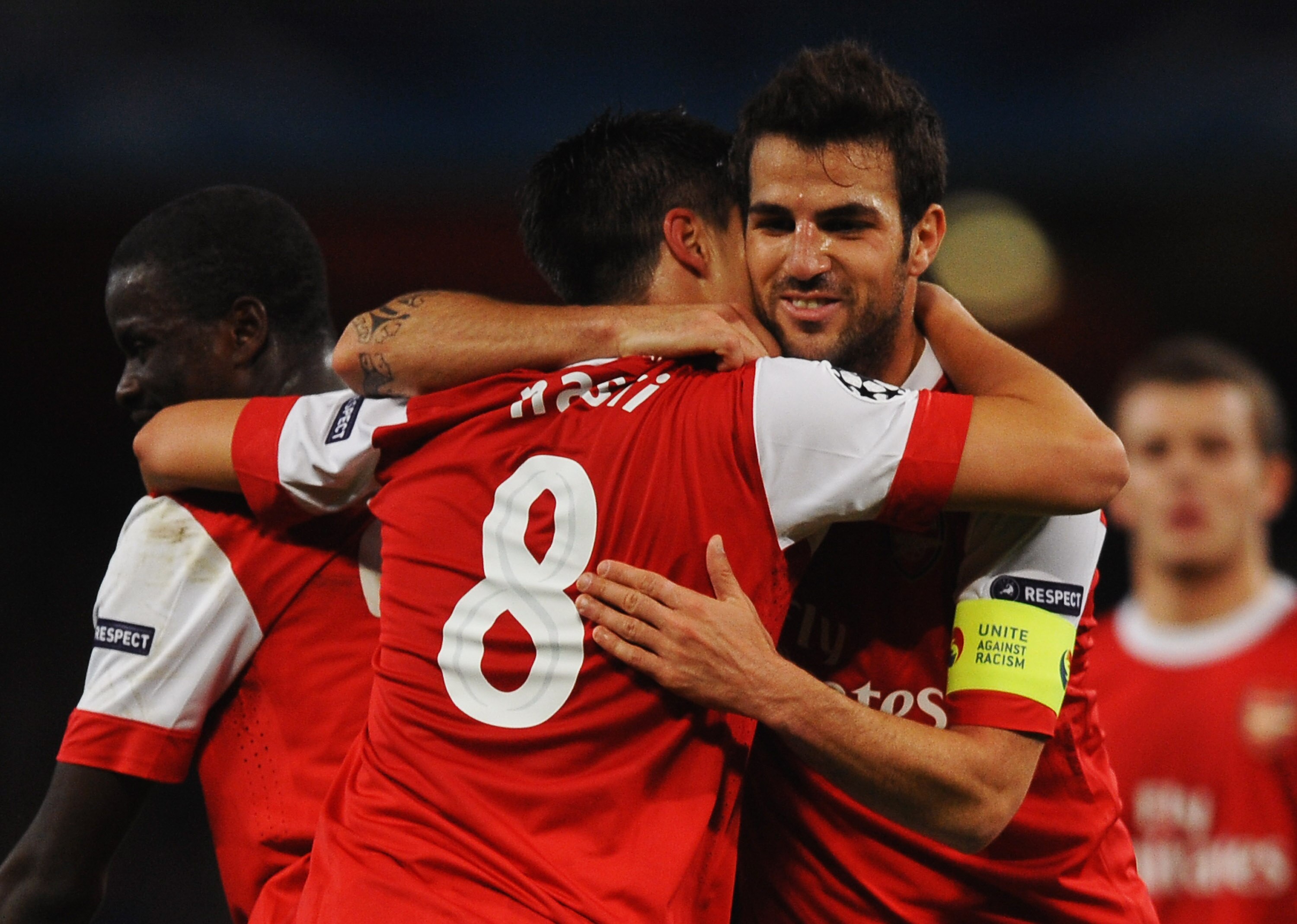 LONDON, ENGLAND - OCTOBER 19:  Samir Nasri of Arsenal (8) celebrates with team mate Cesc Fabregas as he scores their second goal during the UEFA Champions League Group H match between Arsenal and FC Shakhtar Donetsk at the Emirates Stadium on October 19,