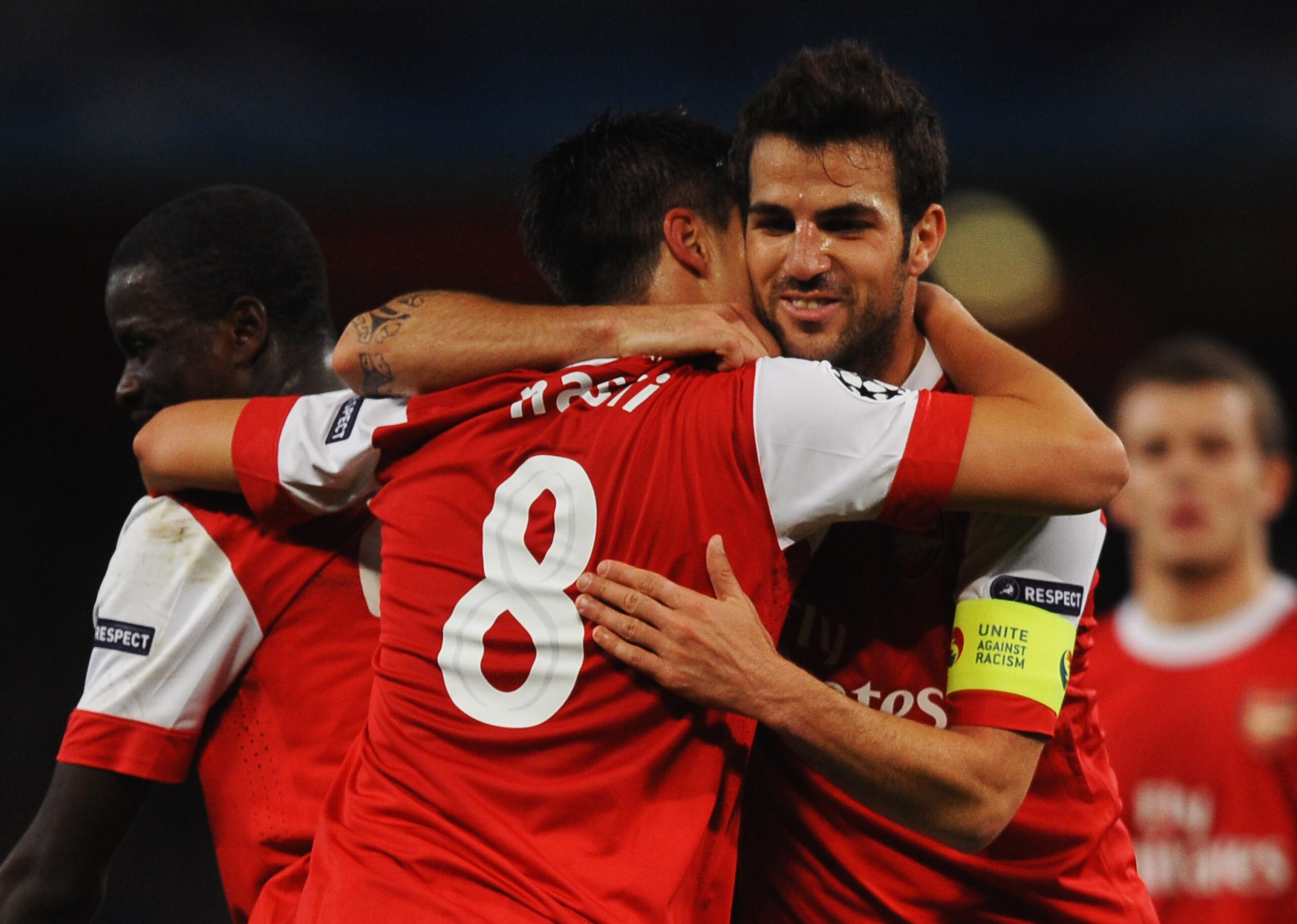 LONDON, ENGLAND - OCTOBER 19:  Samir Nasri of Arsenal (8) celebrates with team mate Cesc Fabregas as he scores their second goal during the UEFA Champions League Group H match between Arsenal and FC Shakhtar Donetsk at the Emirates Stadium on October 19,