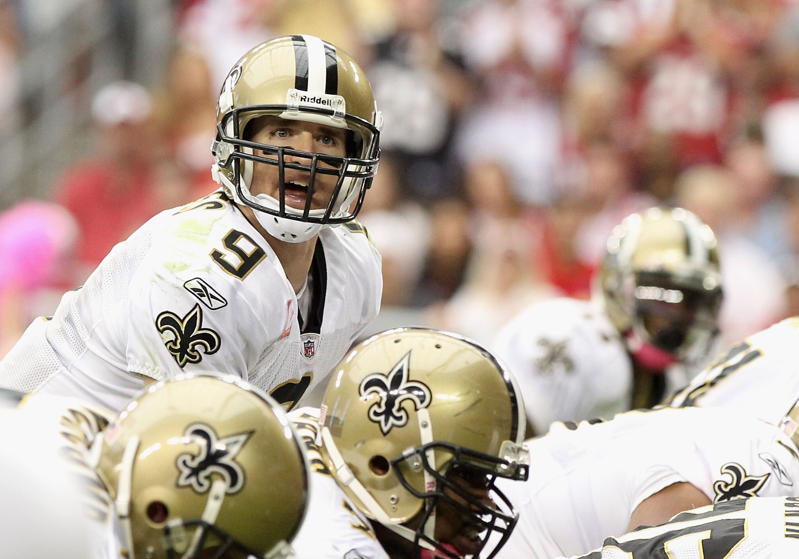 GLENDALE, AZ - OCTOBER 10:  Quarterback Drew Brees #9 of the New Orleans Saints prepares to snap the ball during the NFL game against the Arizona Cardinals at the University of Phoenix Stadium on October 10, 2010 in Glendale, Arizona. The Cardinals defeat