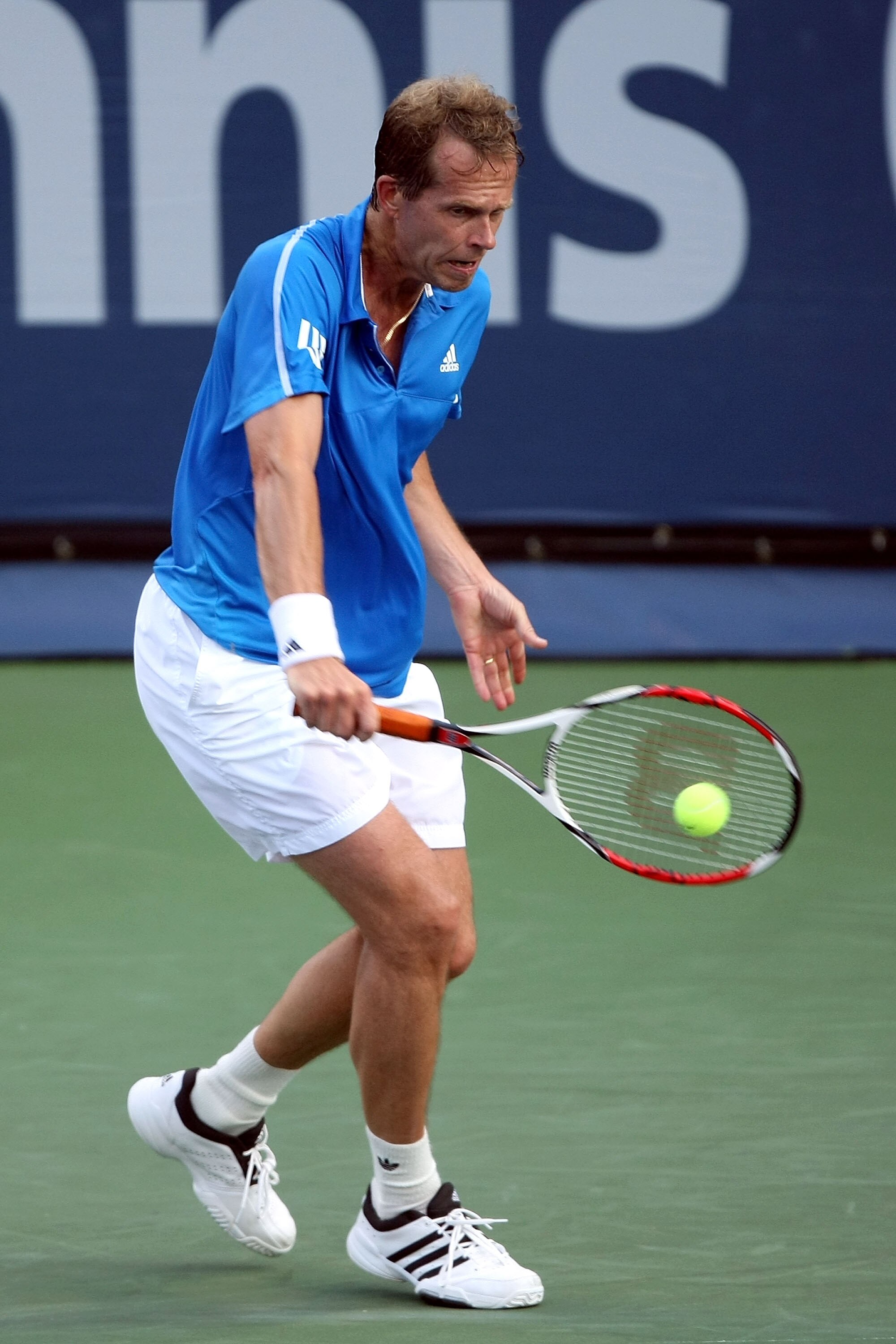 LOS ANGELES, CA - JULY 29:  Stefan Edberg returns a shot to Jim Courier during the Legends match at the LA Tennis Open Day Three at Los Angeles Tennis Center - UCLA on July 29, 2009 in Los Angeles, California.  (Photo by Stephen Dunn/Getty Images)