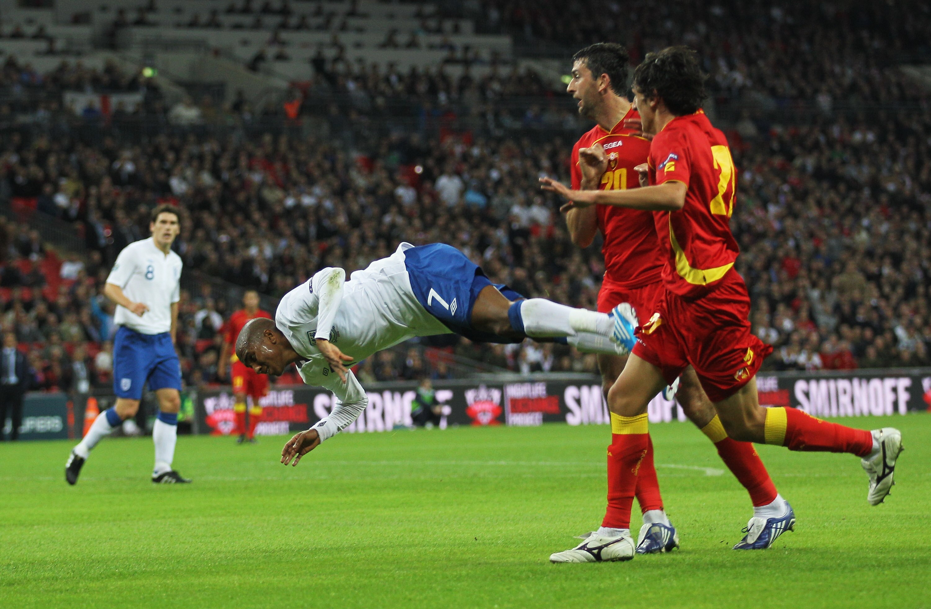 LONDON, ENGLAND - OCTOBER 12: Ashley Young of England goes to ground in the penalty area during the UEFA EURO 2012 Group G Qualifying match between England and Montenegro at Wembley Stadium on October 12, 2010 in London, England.  (Photo by Hamish Blair/G