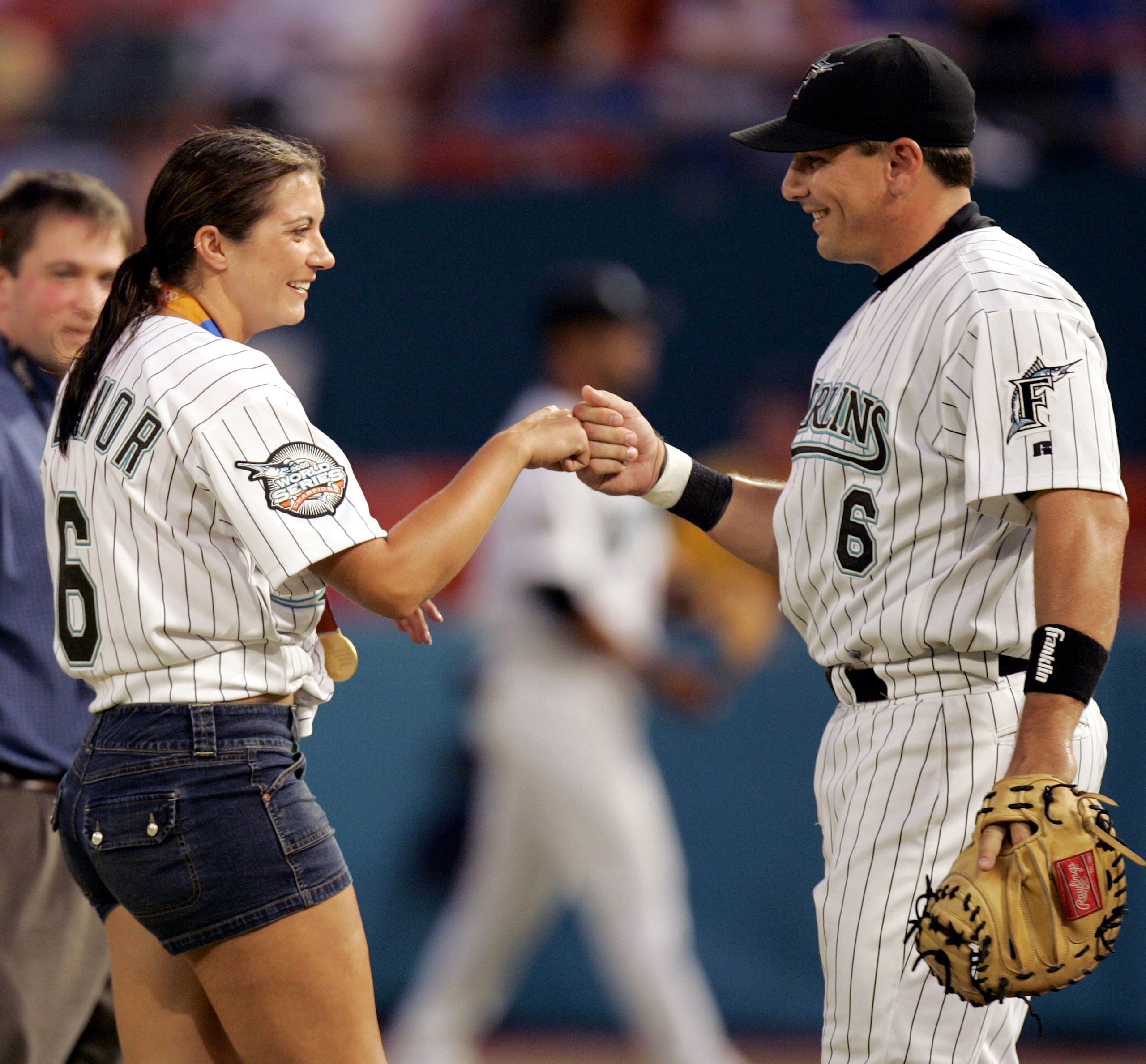 MIAMI - SEPTEMBER 17:  Olympic Gold Medalist in Beach Volleyball, Misty May, is greeted by her fiancee, Matt Treanor #6 of the Florida Marlins, after throwing the ritual first pitch before the start of the Florida Marlins against the Atlanta Braves on Sep