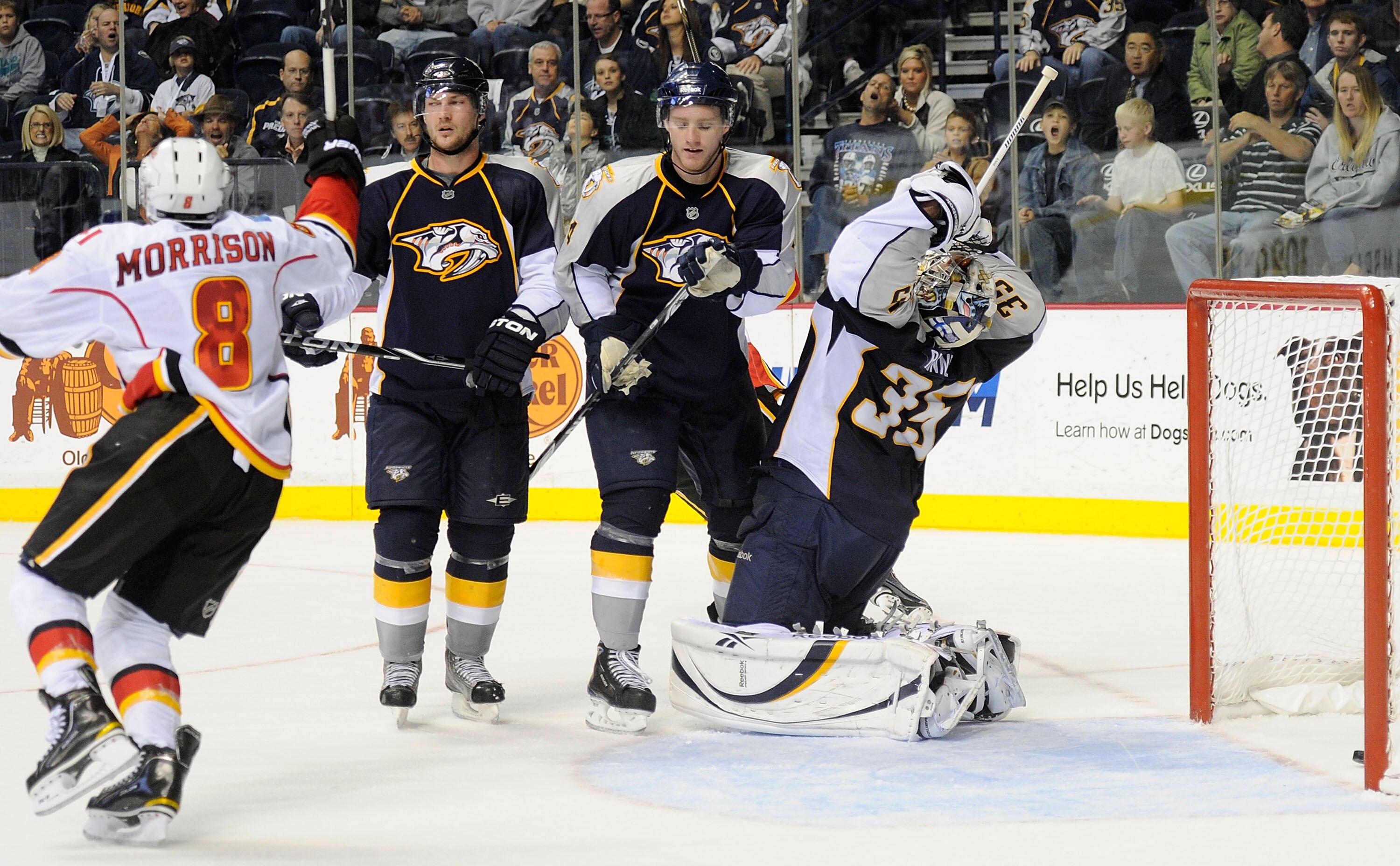 NASHVILLE, TN - OCTOBER 19:  Goalie Pekka Rinne #35 of the Nashville Predators reacts after giving up the game winning overtime goal as Predators defensemen Kevin Klein #8 and Cody Franson #4 watch Brendan Morrison #8 of the Calgary Flames celebrate on Oc