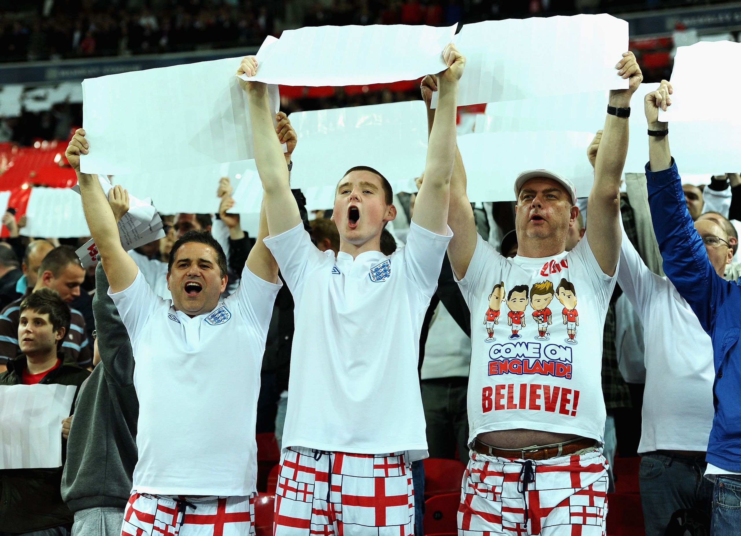LONDON, ENGLAND - OCTOBER 12: England fans show their support during the UEFA EURO 2012 Group G Qualifying match between England and Montenegro at Wembley Stadium on October 12, 2010 in London, England. (Photo by Mike Hewitt/Getty Images) LONDON, ENGLAND - OCTOBER 12: England fans show their support during the UEFA EURO 2012 Group G Qualifying match between England and Montenegro at Wembley Stadium on October 12, 2010 in London, England. (Photo by Mike Hewitt/Getty Images)