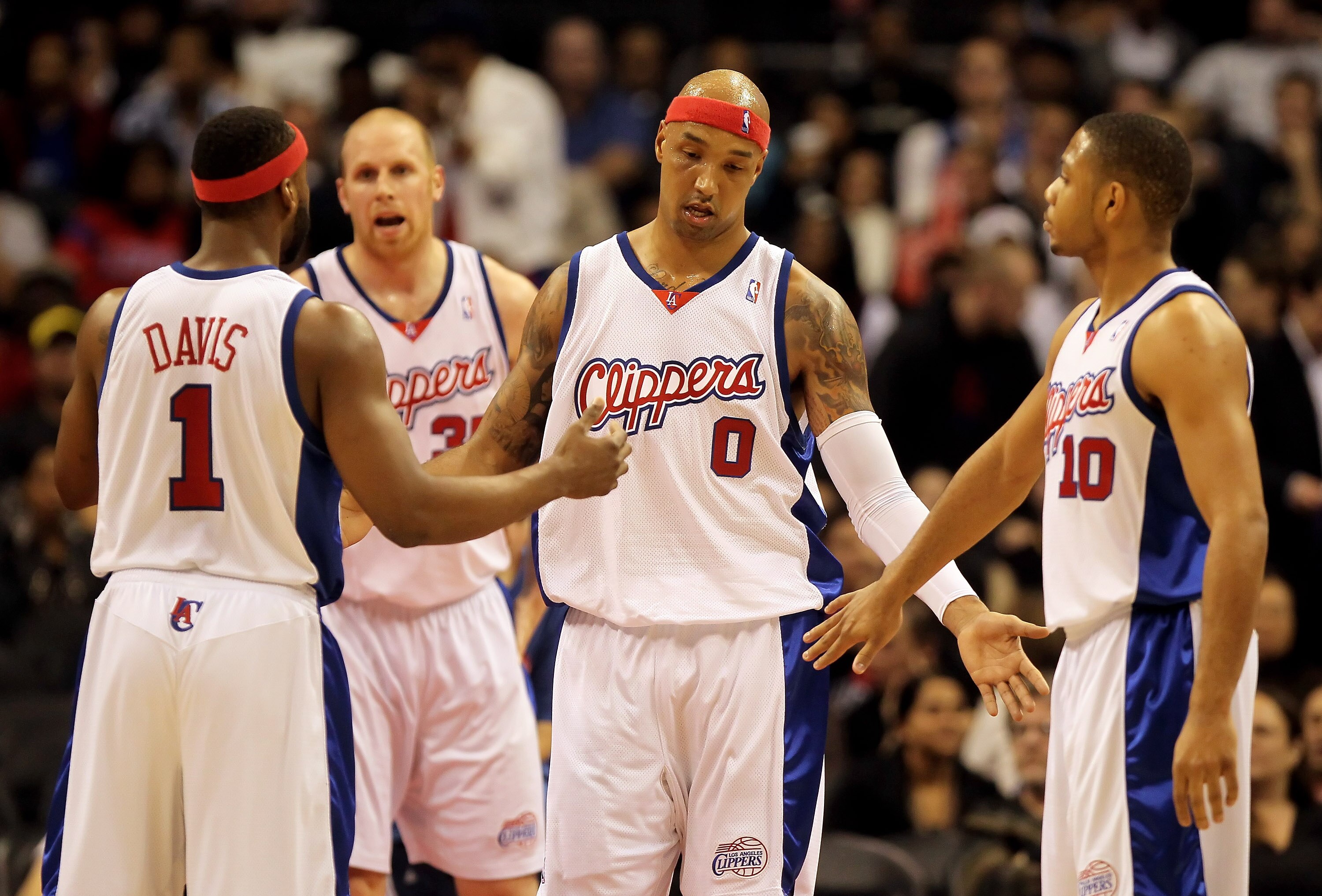 LOS ANGELES, CA - FEBRUARY 24:  Drew Gooden #0 of the Los Angeles Clippers is congratulated by Baron Davis (L) #1 and Eric Gordon (R) #10 after scoring a basket against the Detroit Pistons during the first half at Staples Center on February 24, 2010 in Lo