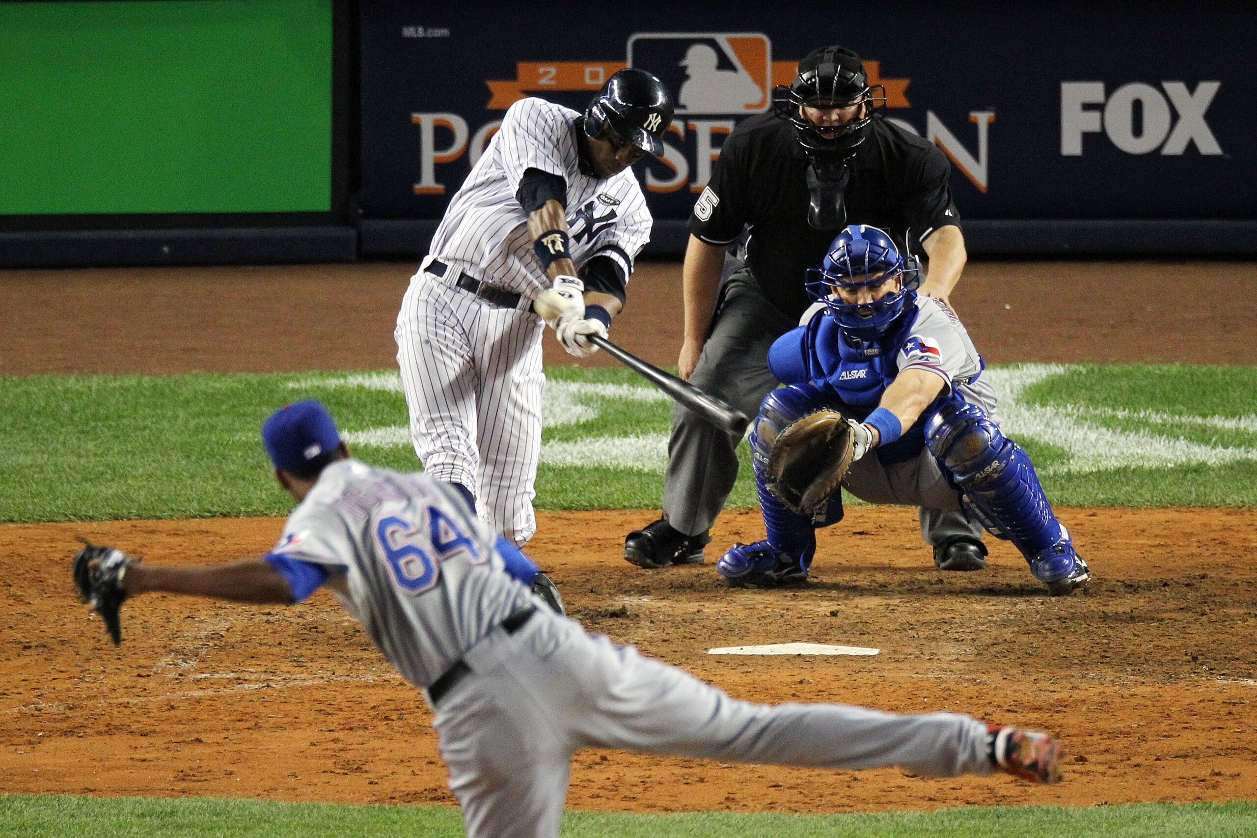 NEW YORK - OCTOBER 20:  Curtis Granderson #14 of the New York Yankees hits a solo home run in the bottom of the eighth inning against Alexi Ogando #64 of the Texas Rangers in Game Five of the ALCS during the 2010 MLB Playoffs at Yankee Stadium on October 