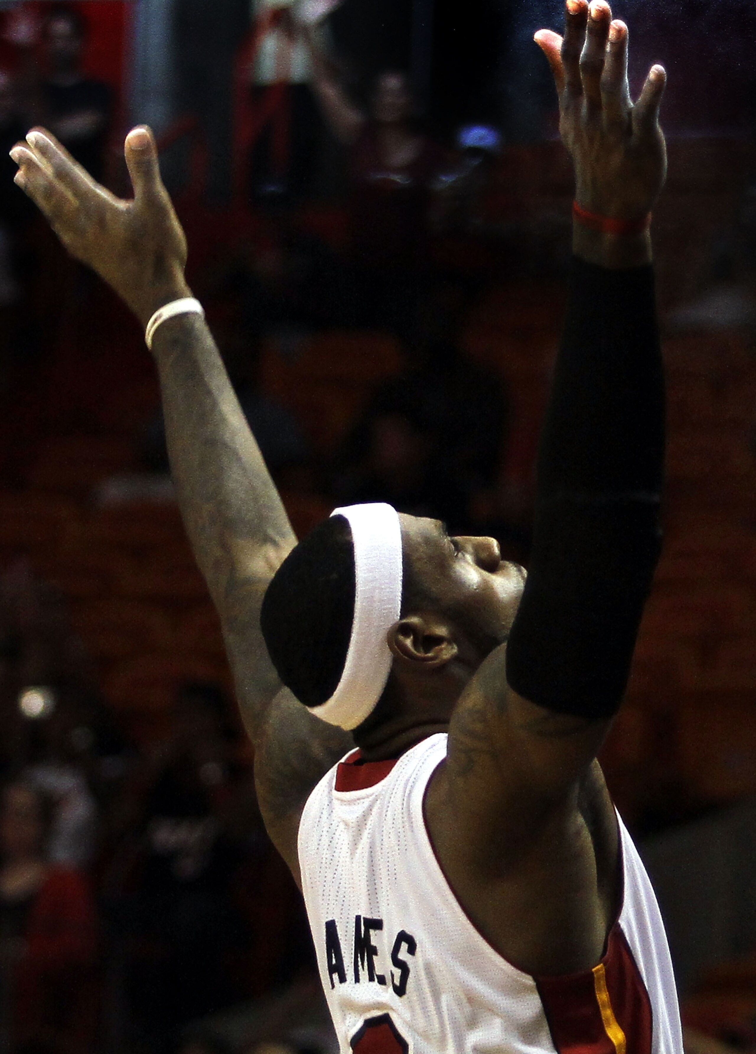 MIAMI - OCTOBER 18:  Forward LeBron James #6 of the Miami Heat prepares to face the Charlotte Bobcats on October 18, 2010 at American Airlines Arena in Miami, Florida. NOTE TO USER: User expressly acknowledges and agrees that, by downloading and/or using 