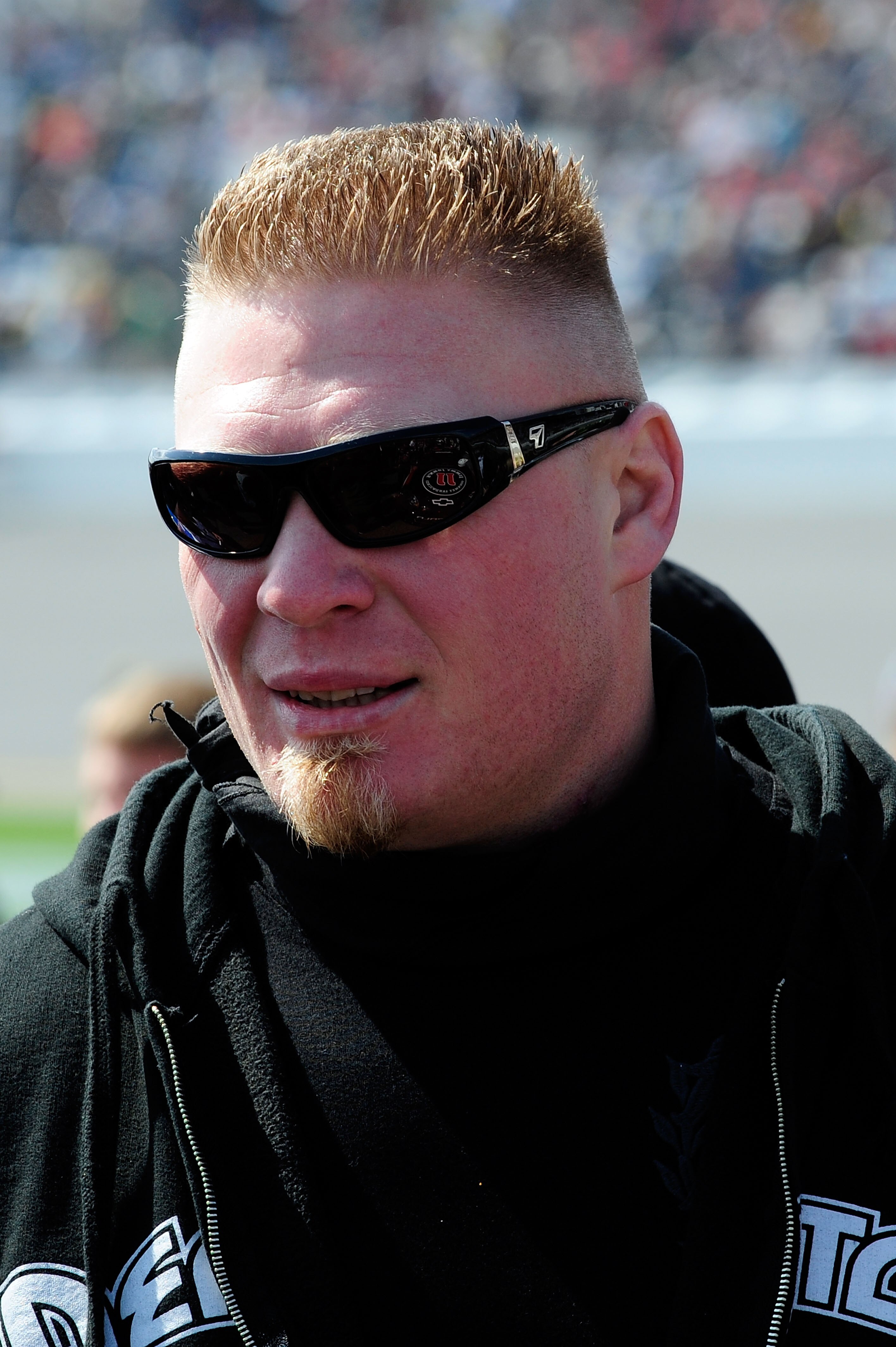 DAYTONA BEACH, FL - FEBRUARY 13:  MMA fighter Brock Lesnar walks in the garage area during the NASCAR Nationwide Series Drive4COPD 300 at Daytona International Speedway on February 13, 2010 in Daytona Beach, Florida.  (Photo by Sam Greenwood/Getty Images)