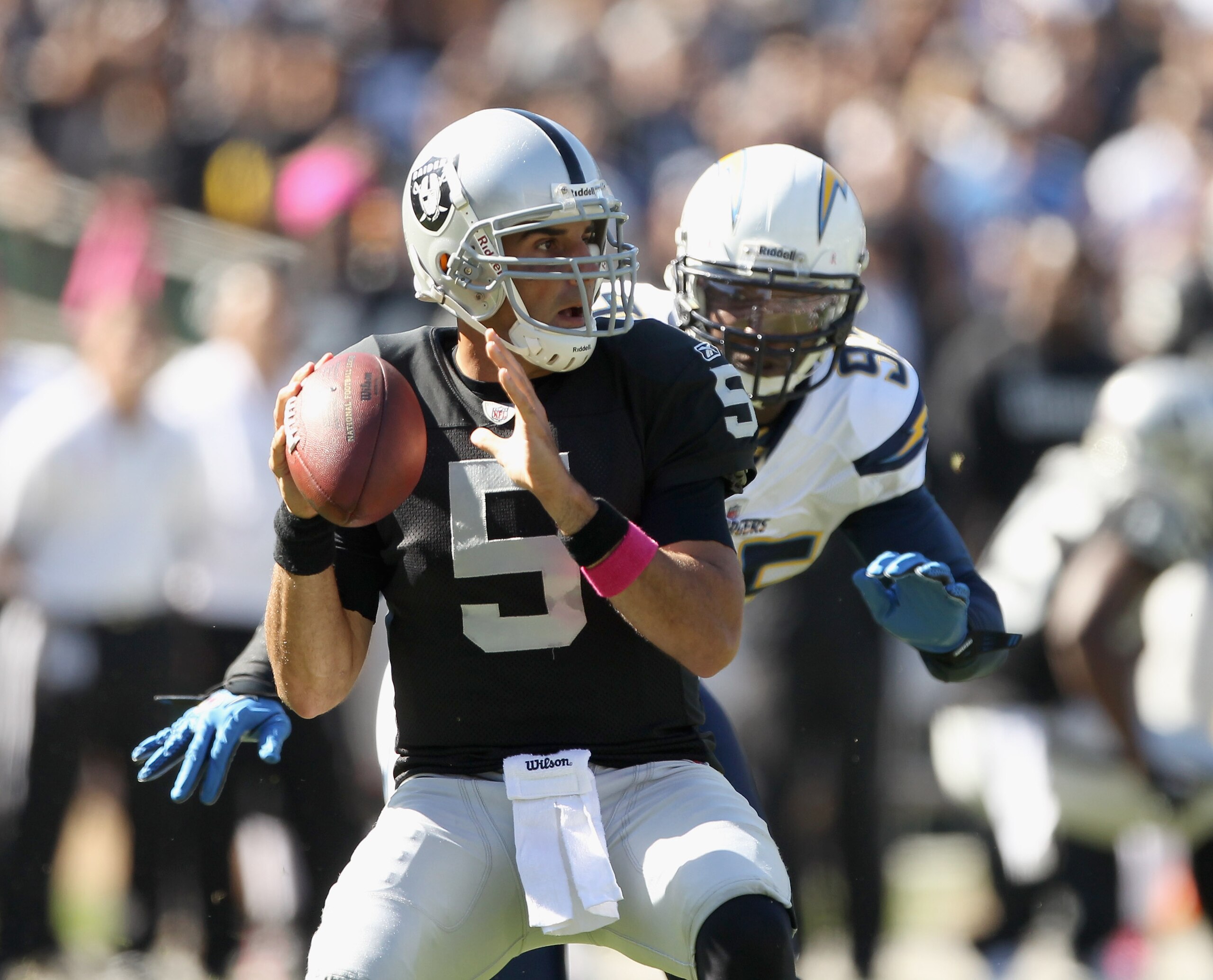 OAKLAND, CA - OCTOBER 10:  Bruce Gradkowski #5 of the Oakland Raiders passes the ball against the San Diego Chargers at Oakland-Alameda County Coliseum on October 10, 2010 in Oakland, California.  (Photo by Ezra Shaw/Getty Images)