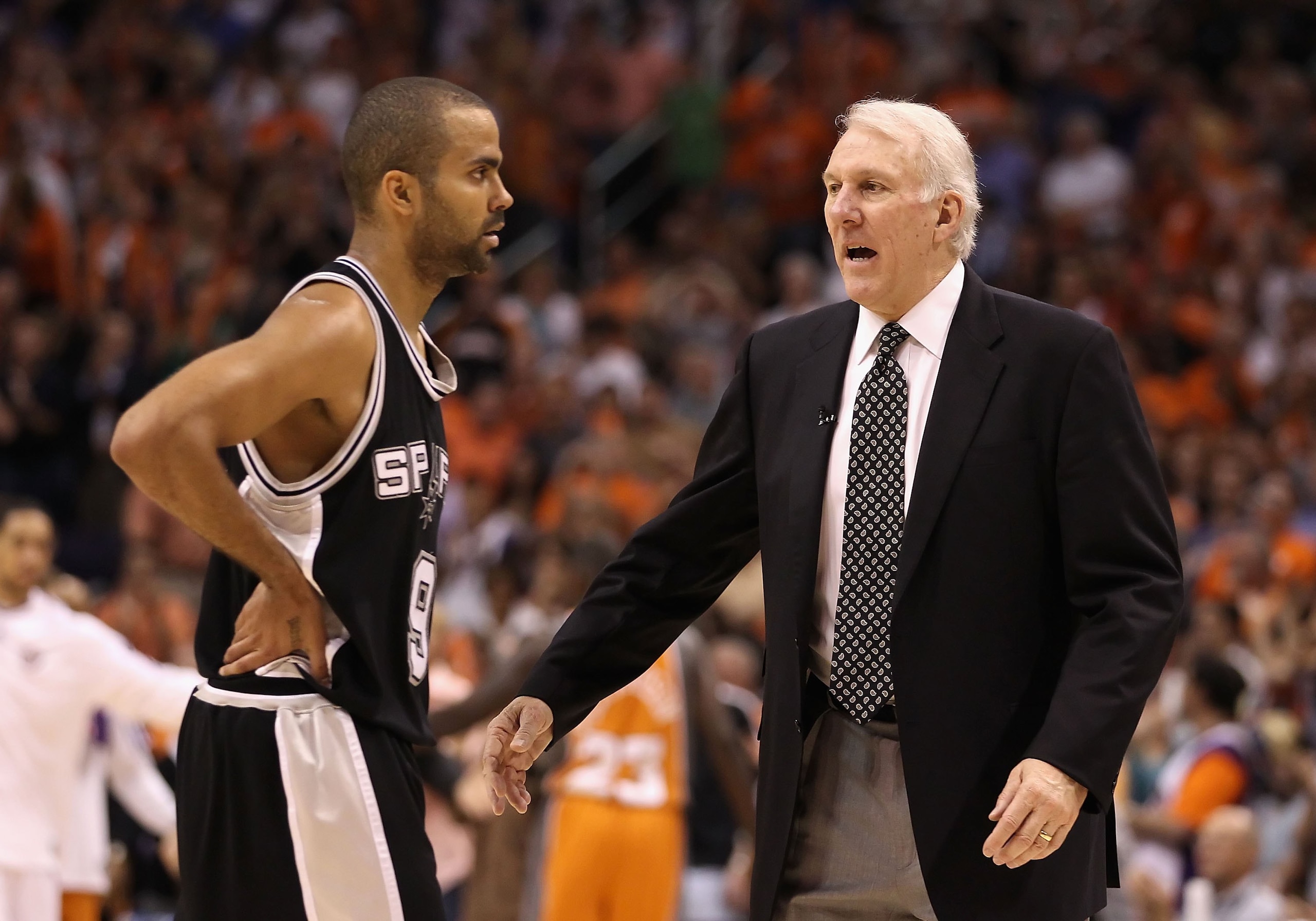 PHOENIX - MAY 05:  Head coach Gregg Popovich of the San Antonio Spurs talks with Tony Parker #9 during Game Two of the Western Conference Semifinals against the Phoenix Suns of the 2010 NBA Playoffs at US Airways Center on May 5, 2010 in Phoenix, Arizona.
