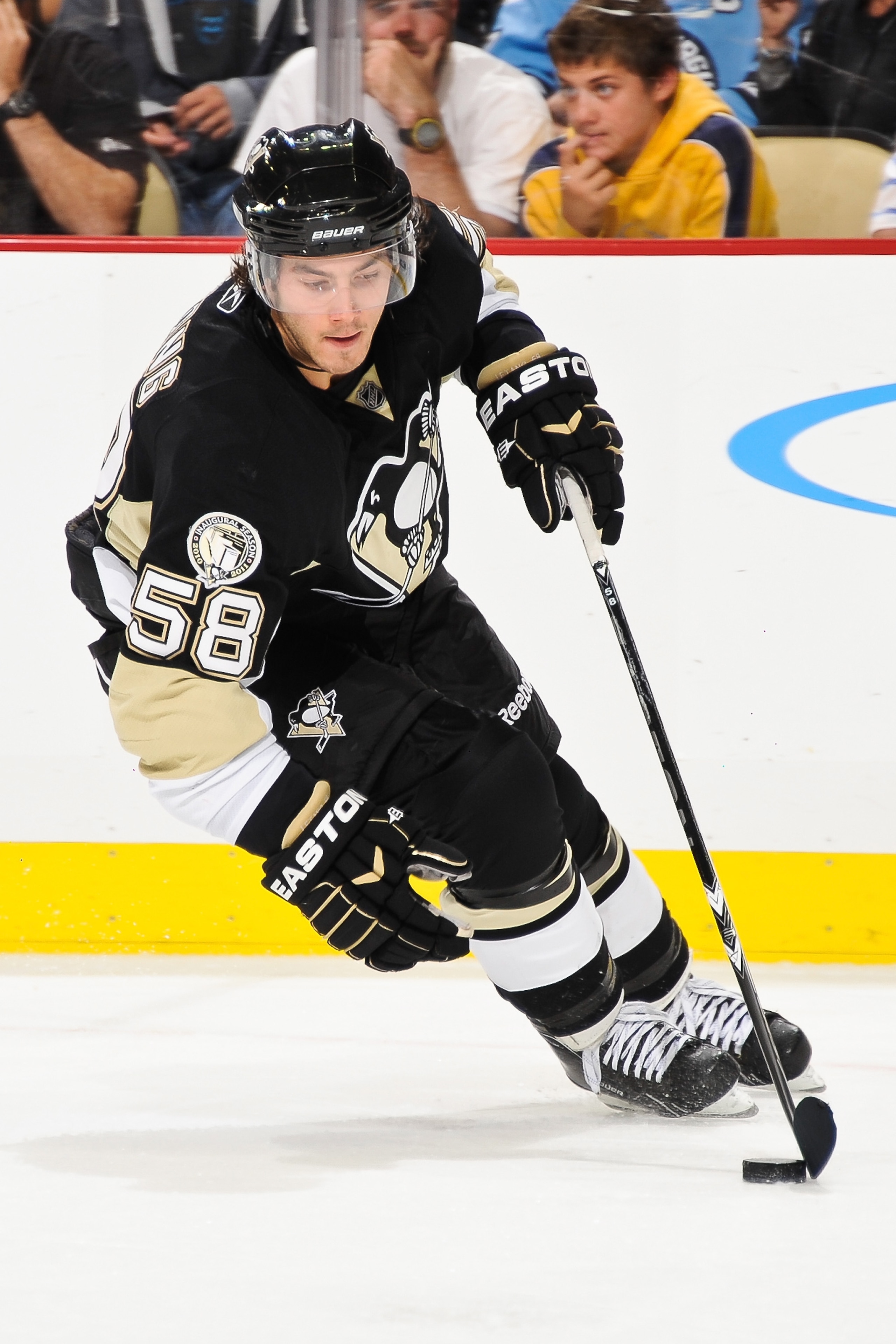 PITTSBURGH - OCTOBER 13:  Kris Letang #58 of the Pittsburgh Penguins skates with the puck against the Toronto Maple Leafs on October 13, 2010 at Consol Energy Center in Pittsburgh, Pennsylvania.  (Photo by Jamie Sabau/Getty Images)