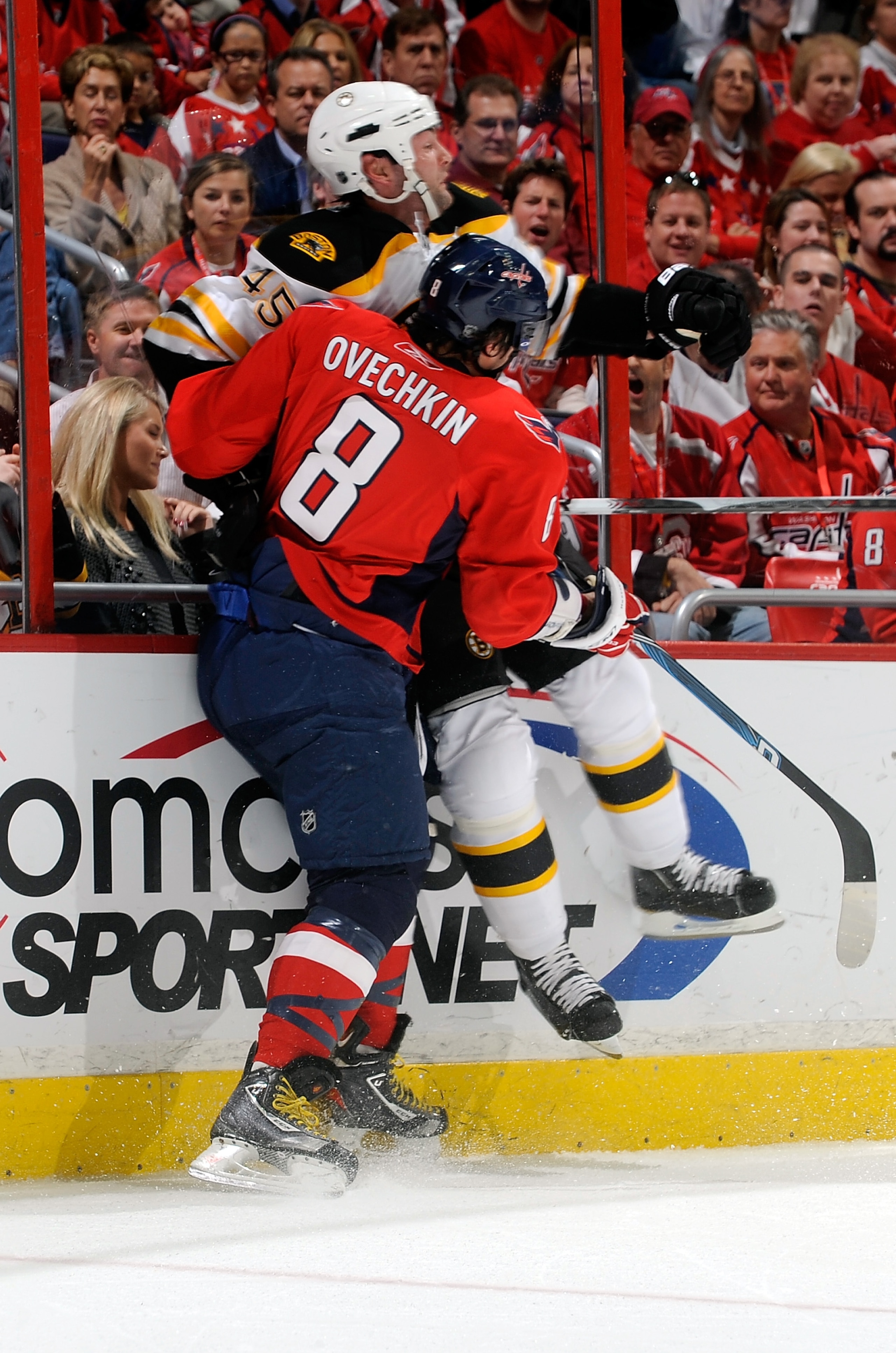 WASHINGTON - OCTOBER 19:  Alex Ovechkin #8 of the Washington Capitals checks Mark Stuart #45 of the Boston Bruins at the Verizon Center on October 19, 2010 in Washington, DC.  (Photo by Greg Fiume/Getty Images)