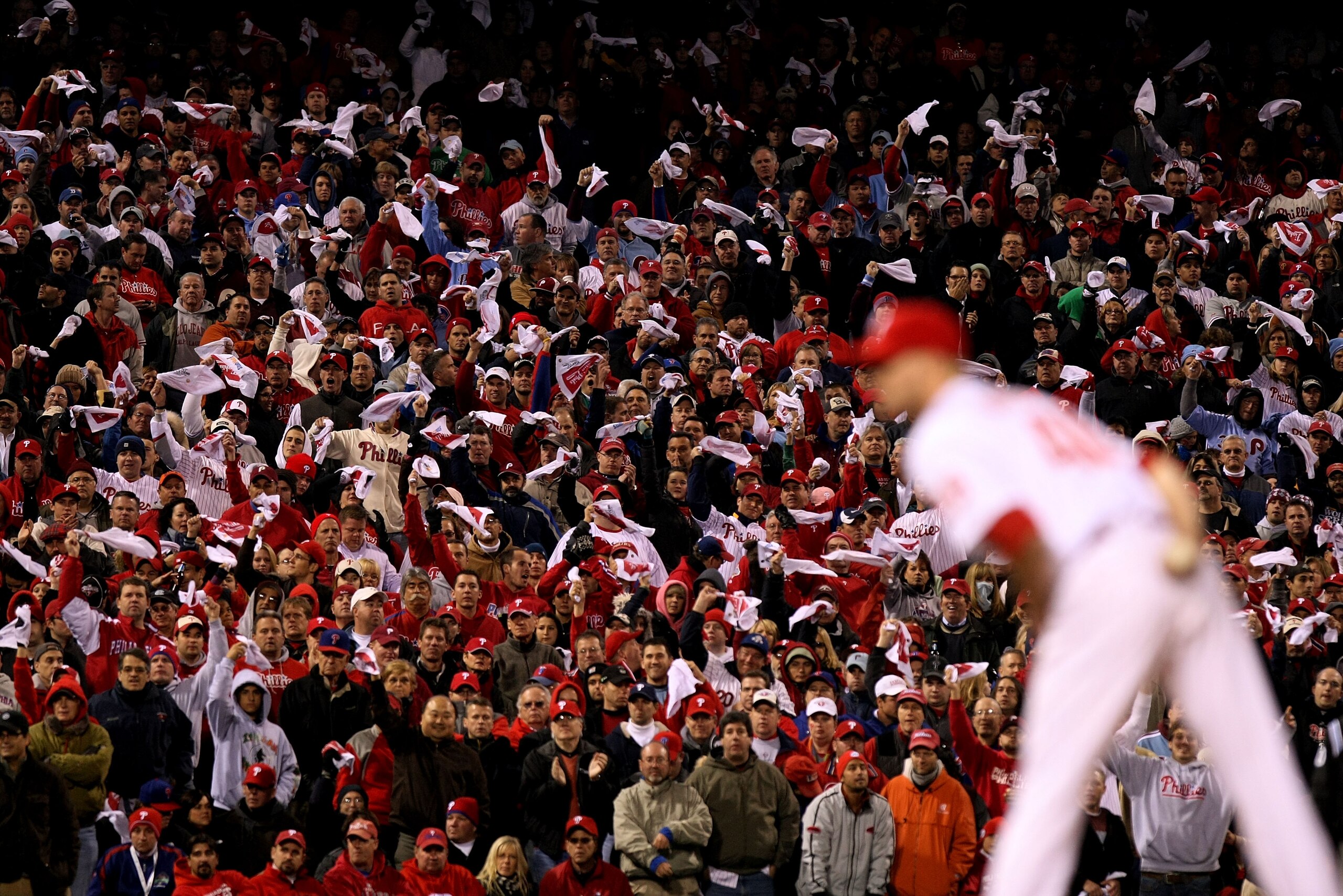 PHILADELPHIA - OCTOBER 19:  Fans of the Philadelphia Phillies wave towels as Ryan Madson #46 of the Phillies gets set to throw a pitch against the Los Angeles Dodgers in Game Four of the NLCS during the 2009 MLB Playoffs at Citizens Bank Park on October 1