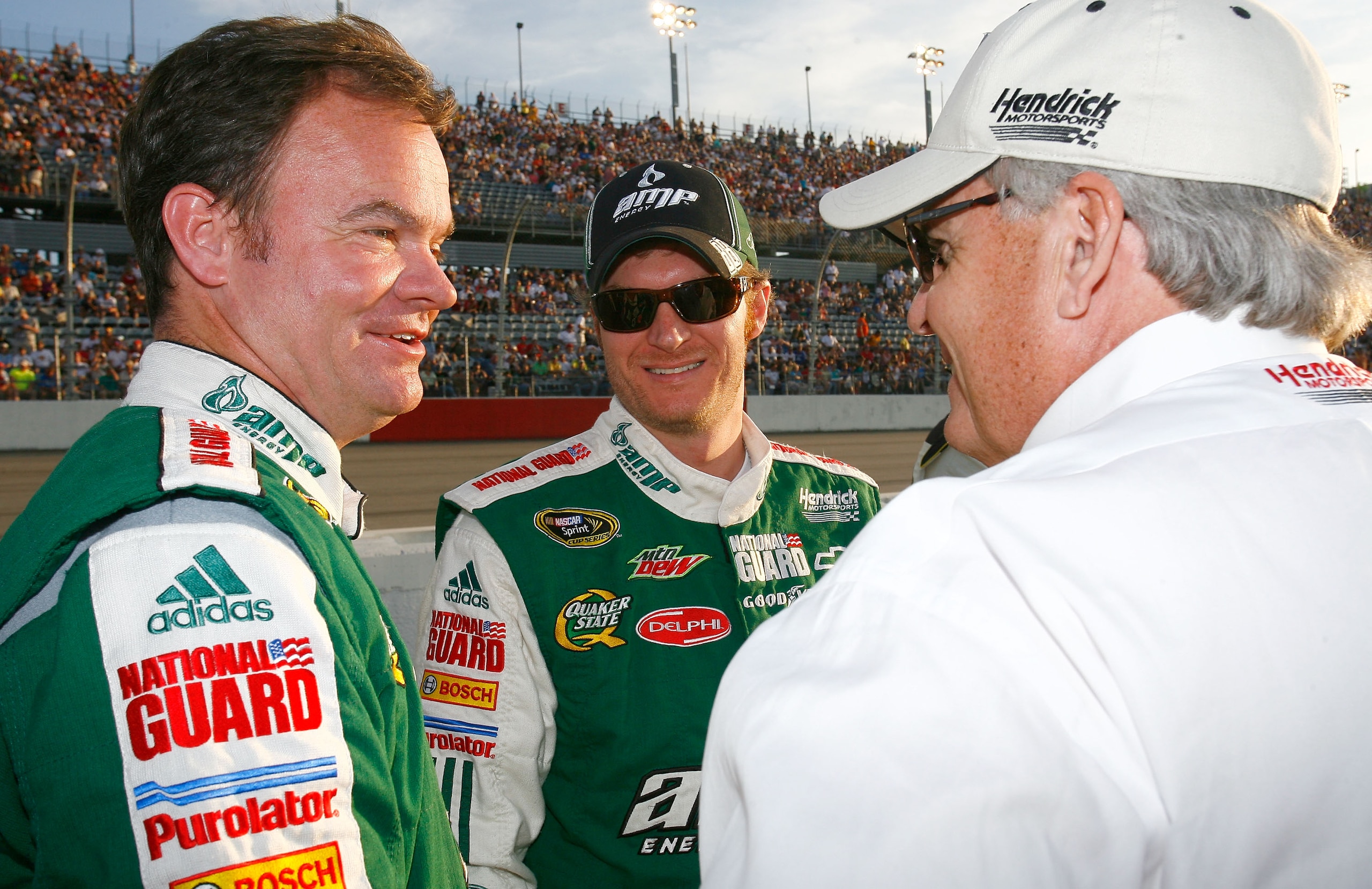 DARLINGTON, SC - MAY 08:  Dale Earnhardt Jr., driver of the #88 AMP Energy / National Guard Chevrolet, talks with crew chief Lance McGrew (L) and team owner Rick Hendrick (R) on the grid prior to the start of the NASCAR Sprint Cup series SHOWTIME Southern
