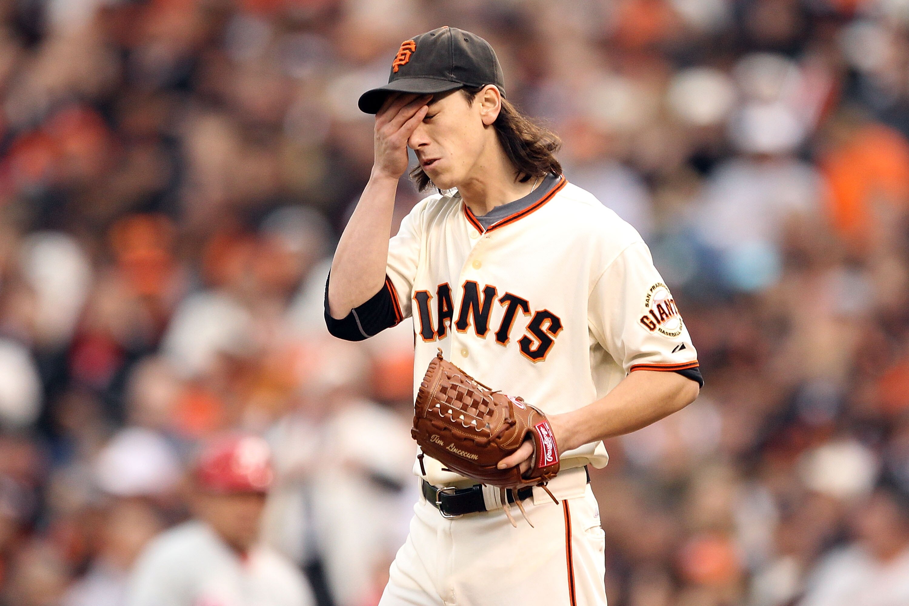 SAN FRANCISCO - OCTOBER 21:  Tim Lincecum #55 of the San Francisco Giants reacts during the third inning against the Philadelphia Phillies in Game Five of the NLCS during the 2010 MLB Playoffs at AT&T Park on October 21, 2010 in San Francisco, California.