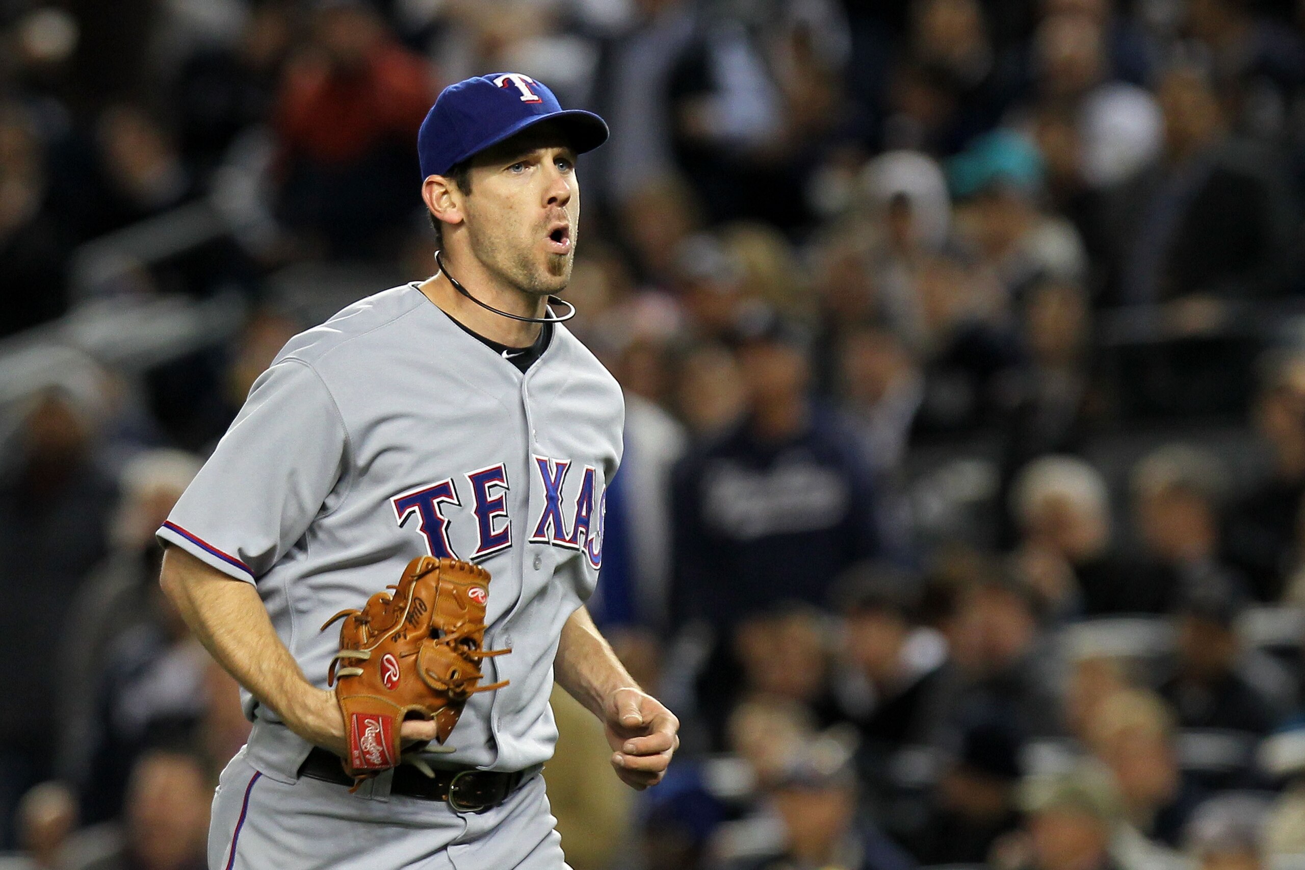 NEW YORK - OCTOBER 18:  Cliff Lee #33 of the Texas Rangers reacts after he forced out Brett Gardner #11 of the New York Yankees at first base in the bottom of the third inning of Game Three of the ALCS during the 2010 MLB Playoffs at Yankee Stadium on Oct