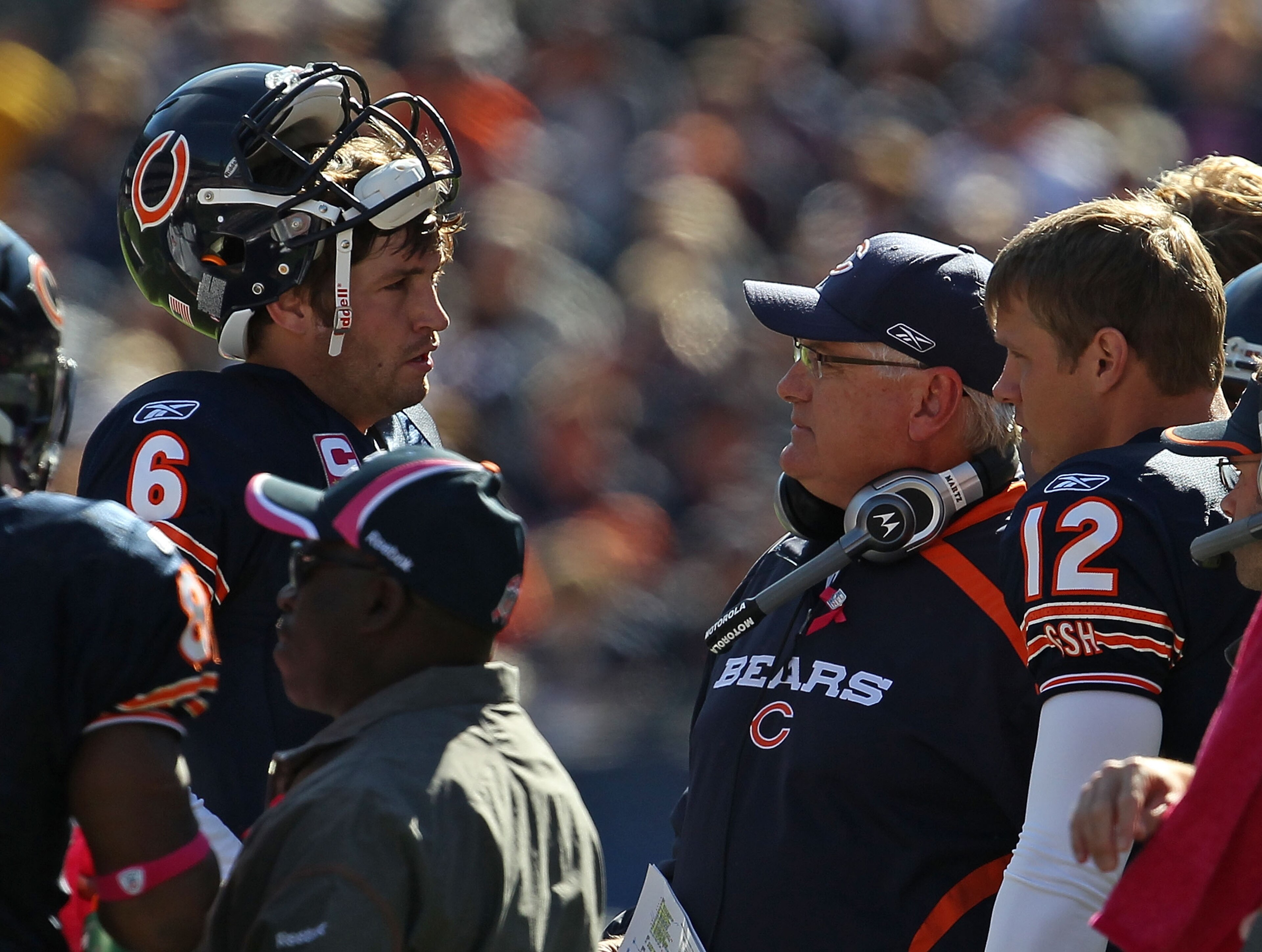 CHICAGO - OCTOBER 17: Jay Cutler #6 of the Chicago Bears talks with offensive coordinator Mike Martz during a time-out as Caleb Hanie #12 listens in against the Seattle Seahawks at Soldier Field on October 17, 2010 in Chicago, Illinois. The Seahawks defea