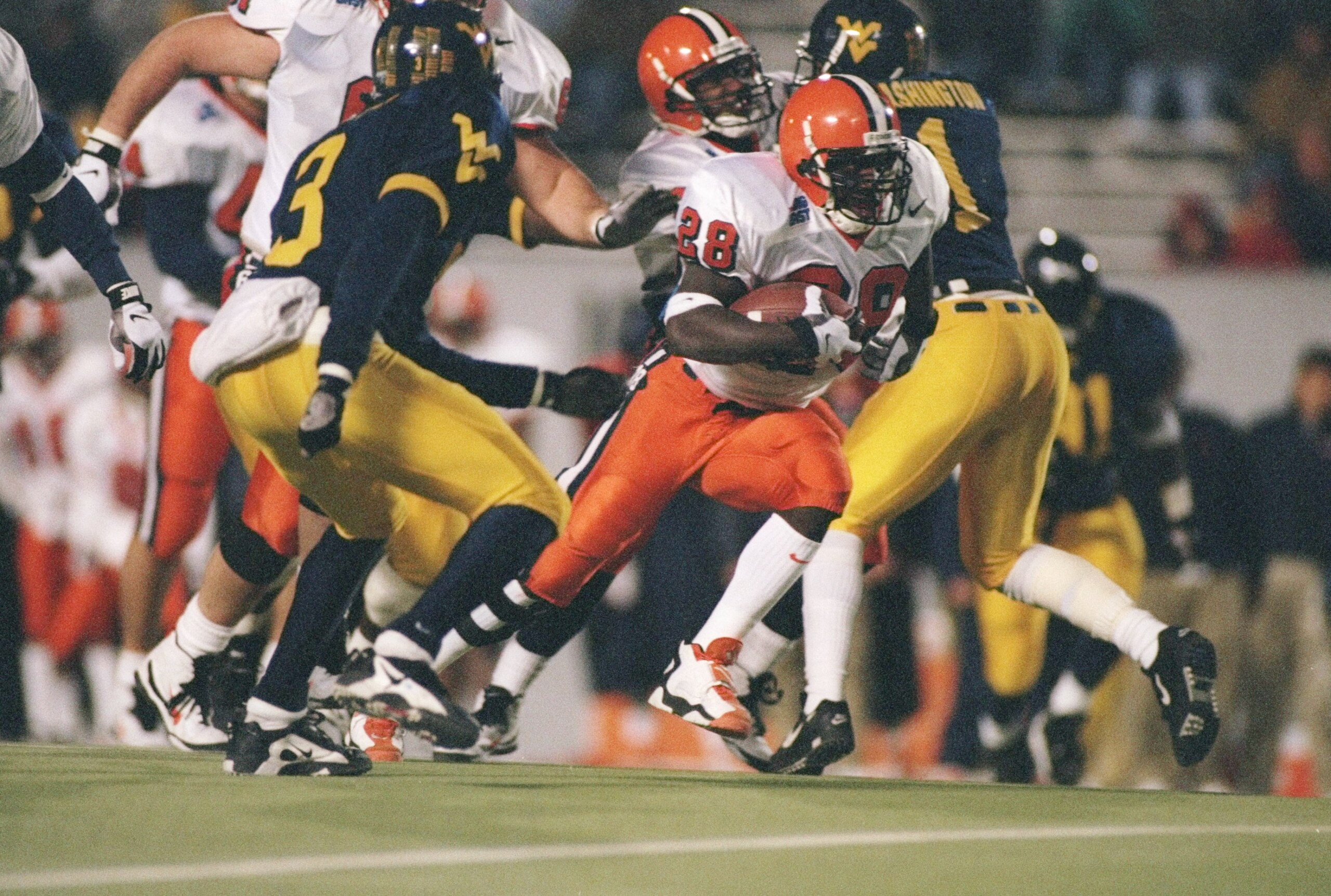 2 Nov 1996:  Tailback Kyle McIntosh of the Syracuse Orangemen runs with the ball during a game against the West Virginia Mountaineers at Mountaineer ield in Morgantown, West Virginia.  Syracuse won the game 30-7. Mandatory Credit: Jamie Squire  /Allsport