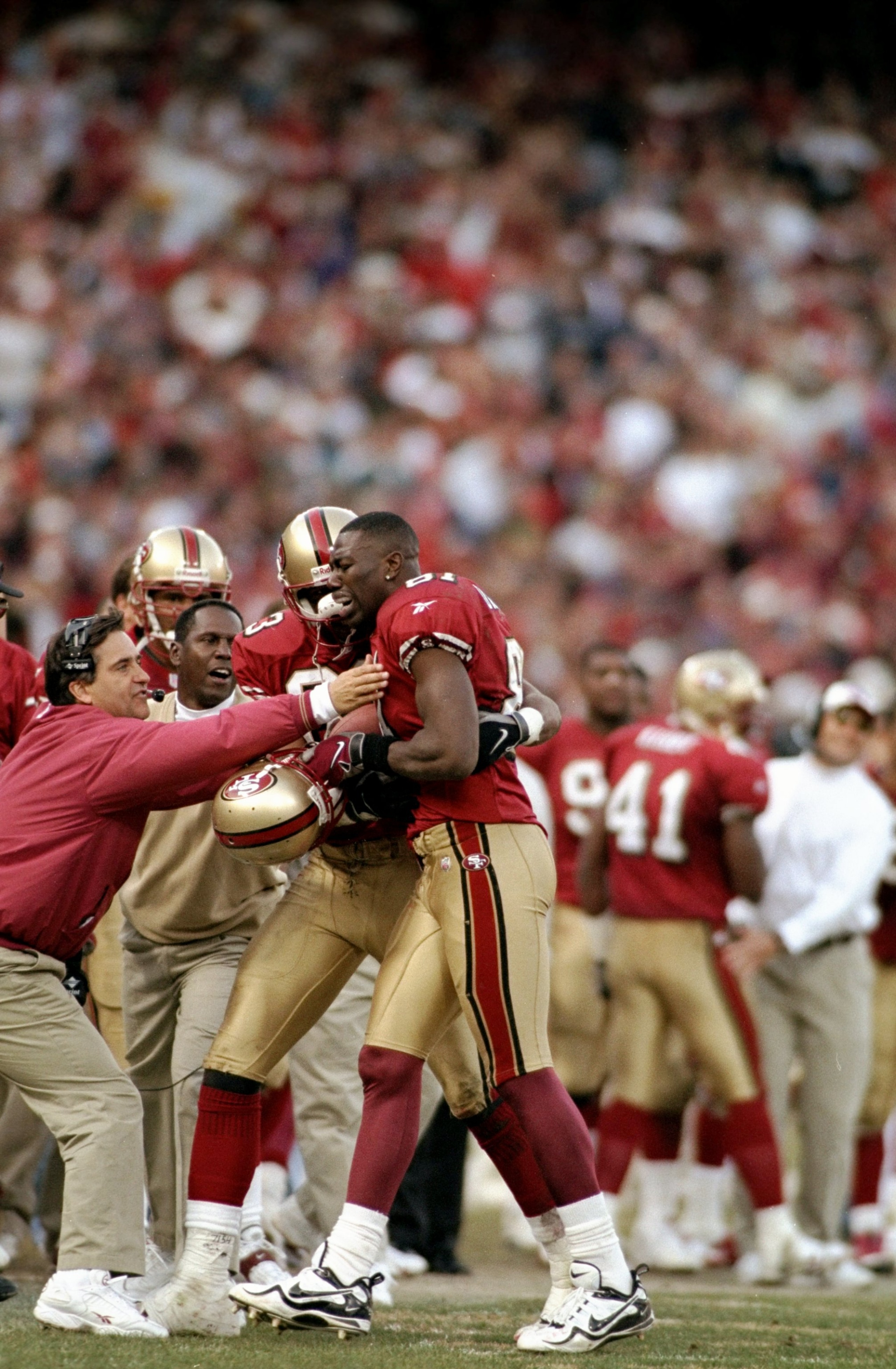 3 Jan 1999:  Terrell Owens #81 of the San Francisco 49ers gets helped off the field by J. J. Stokes during the NFC Wild Card Game against the Green Bay Packers at the 3 Comm Park in San Francisco, California. The 49ers defeated the Packers 24-17. Mandator