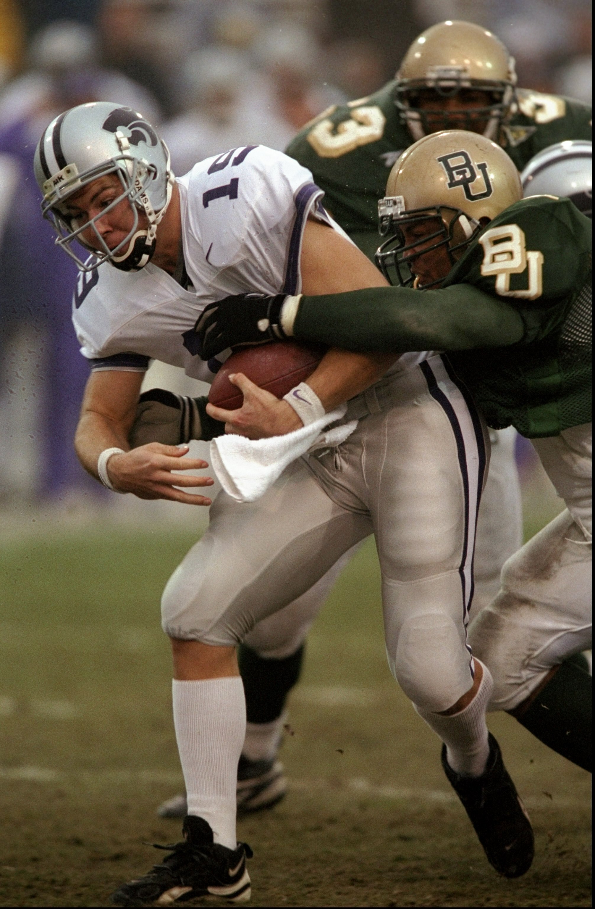 7 Nov 1998:  Adam Helm #19 of the Kansas State Wildcats is tackled by a member of the Baylor Bears during a game at the Floyd Casey Stadium in Waco, Texas. The Wildcats defeated the Bears 49-6. Mandatory Credit: Stephen Dunn  /Allsport