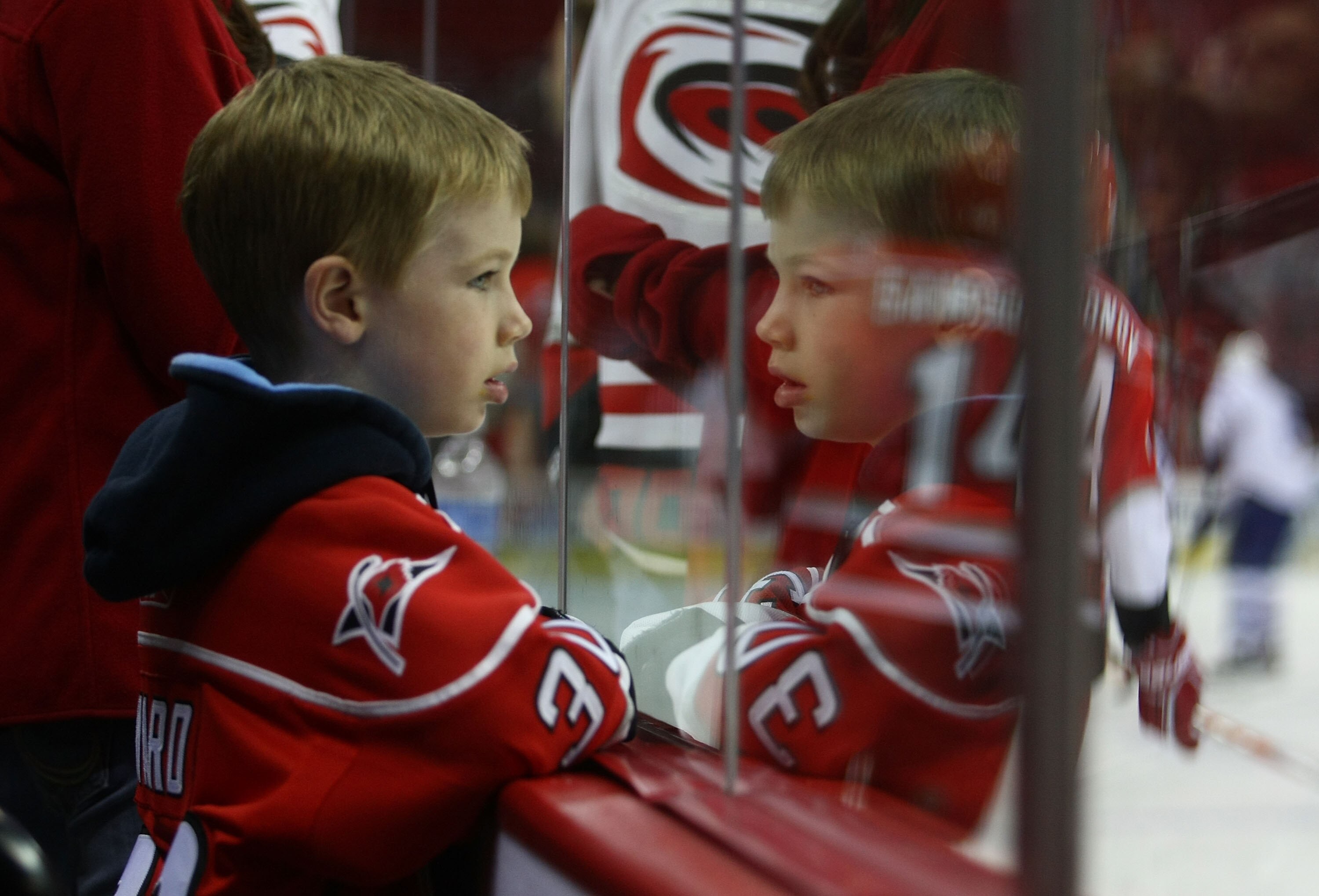RALEIGH, NC - NOVEMBER 19: A Hurricanes fan watches warmups prior to the game between the Toronto Maple Leafs and the Carolina Hurricanes at the RBC Center on November 19, 2009 in Raleigh, North Carolina. (Photo by Bruce Bennett/Getty Images)