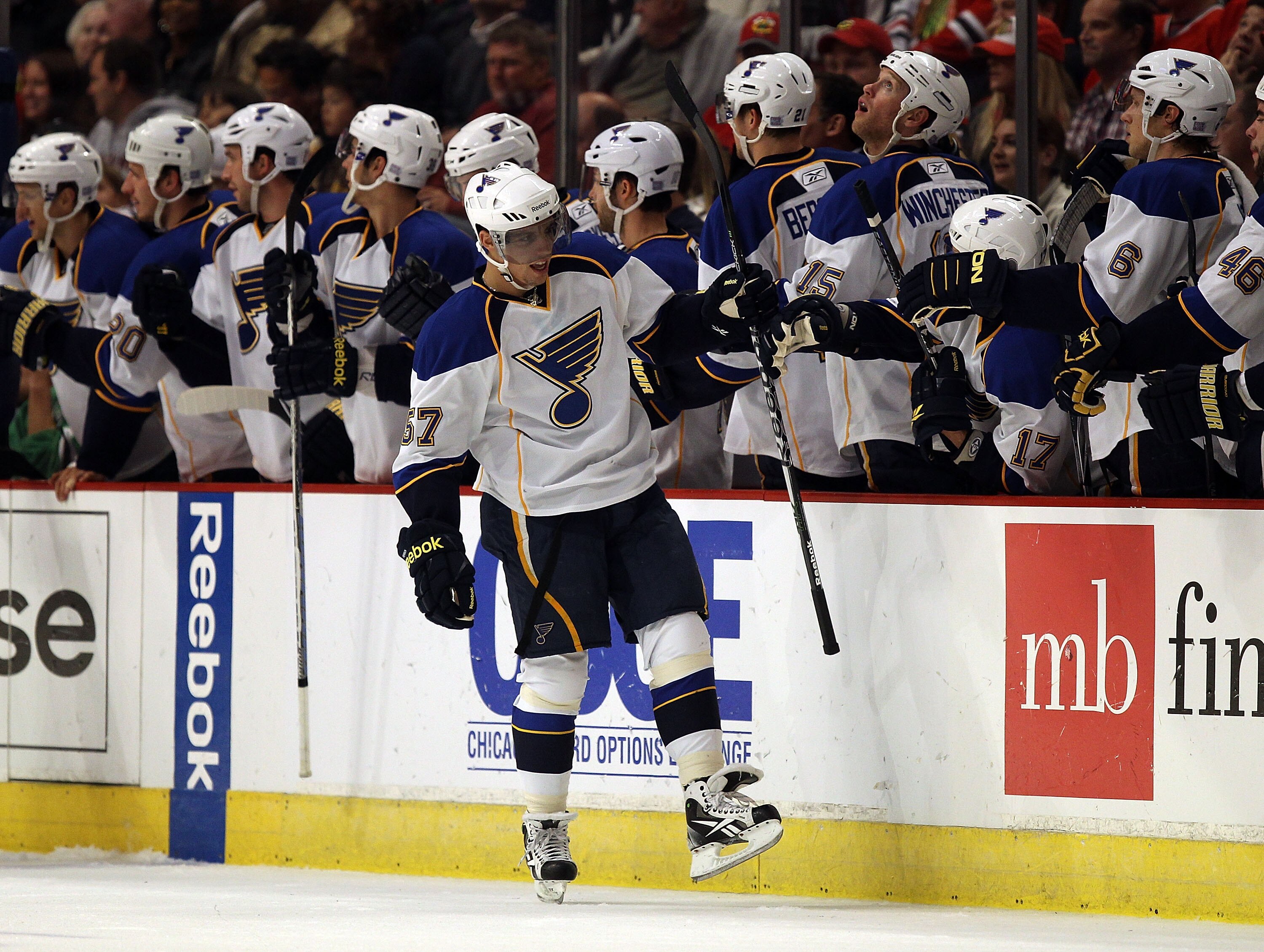 CHICAGO - OCTOBER 18: David Perron #57 of the St. Louis Blues celebrates his 2nd period goal with teammates against the Chicago Blackhawks at the United Center on October 18, 2010 in Chicago, Illinois. (Photo by Jonathan Daniel/Getty Images)