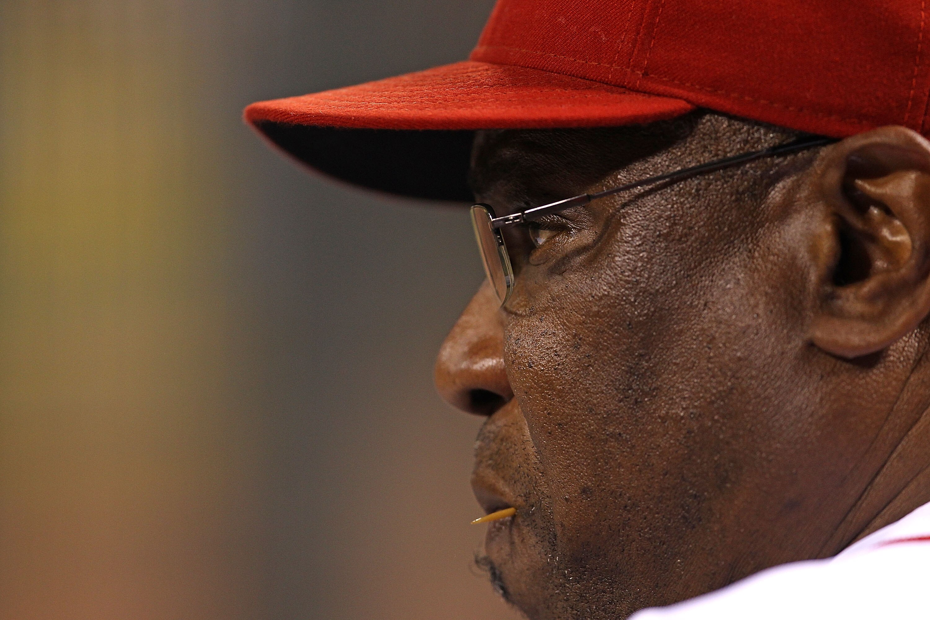 CINCINNATTI - OCTOBER 10: Manager Dusty Baker #12 of the Cincinnati Reds watches as his team takes on the Philadelphia Phillies during game 3 of the NLDS at Great American Ball Park on October 10, 2010 in Cincinnati, Ohio. The Phillies defeated the Reds 2