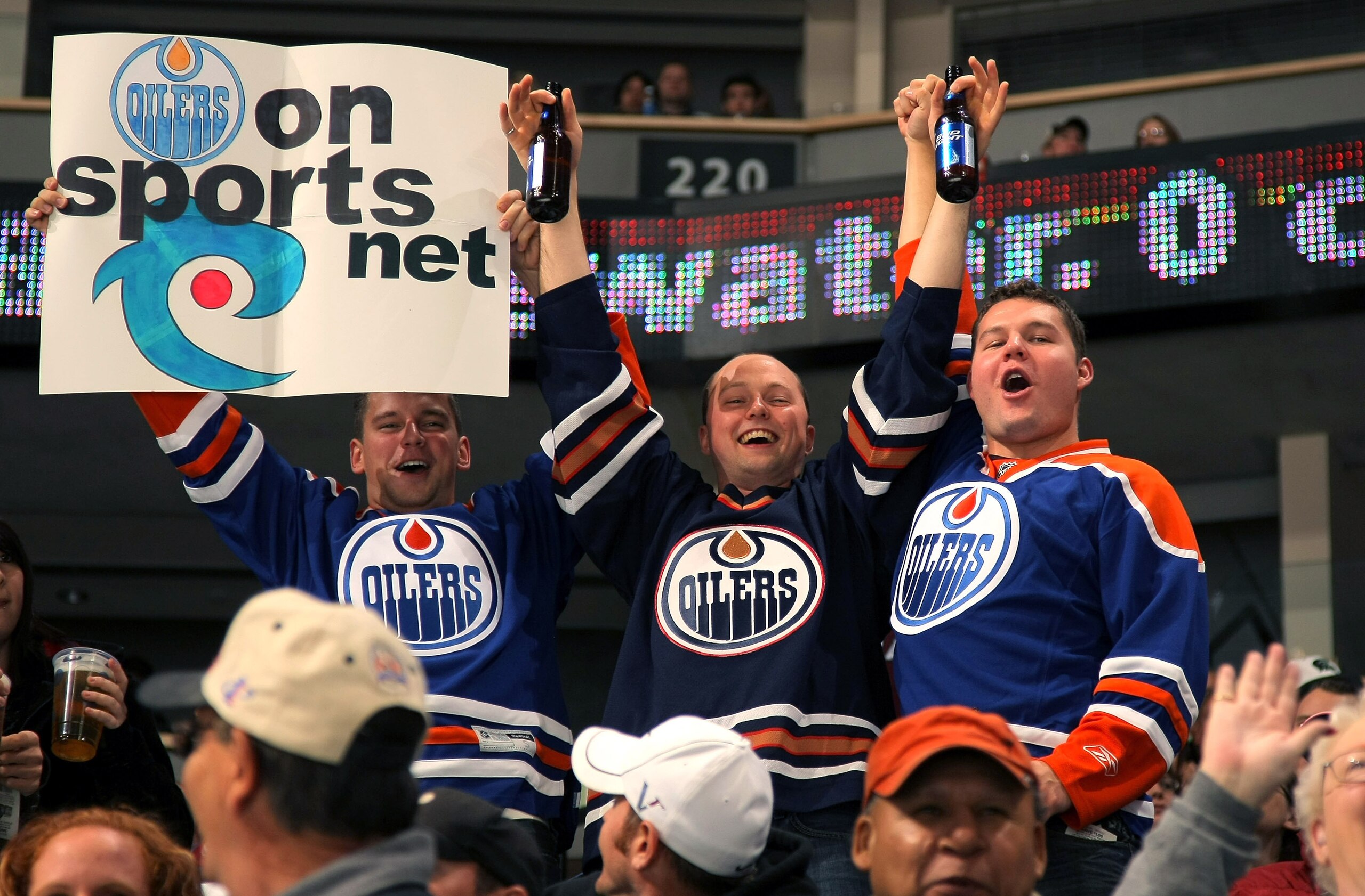 DENVER - NOVEMBER 08:  Fans of the Edmonton Oilers support their team against the Colorado Avalanche during NHL action at the Pepsi Center on November 8, 2009 in Denver, Colorado.  (Photo by Doug Pensinger/Getty Images)