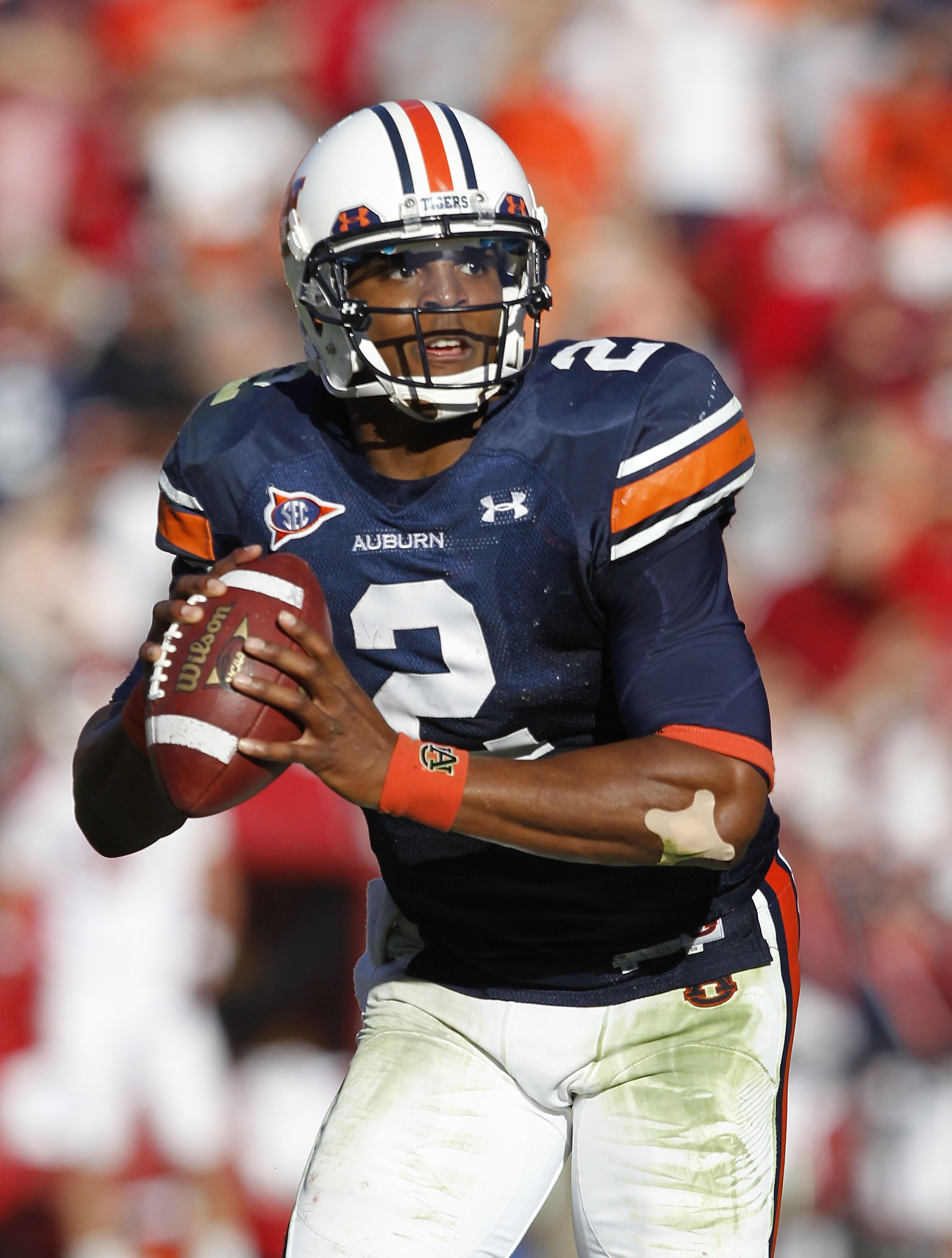 AUBURN, AL - OCTOBER 16:  Quarterback Cam Newton #2 of the Auburn Tigers rolls out during the game against the Arkansas Razorbacks at Jordan-Hare Stadium on October 16, 2010 in Auburn, Alabama.  (Photo by Mike Zarrilli/Getty Images)