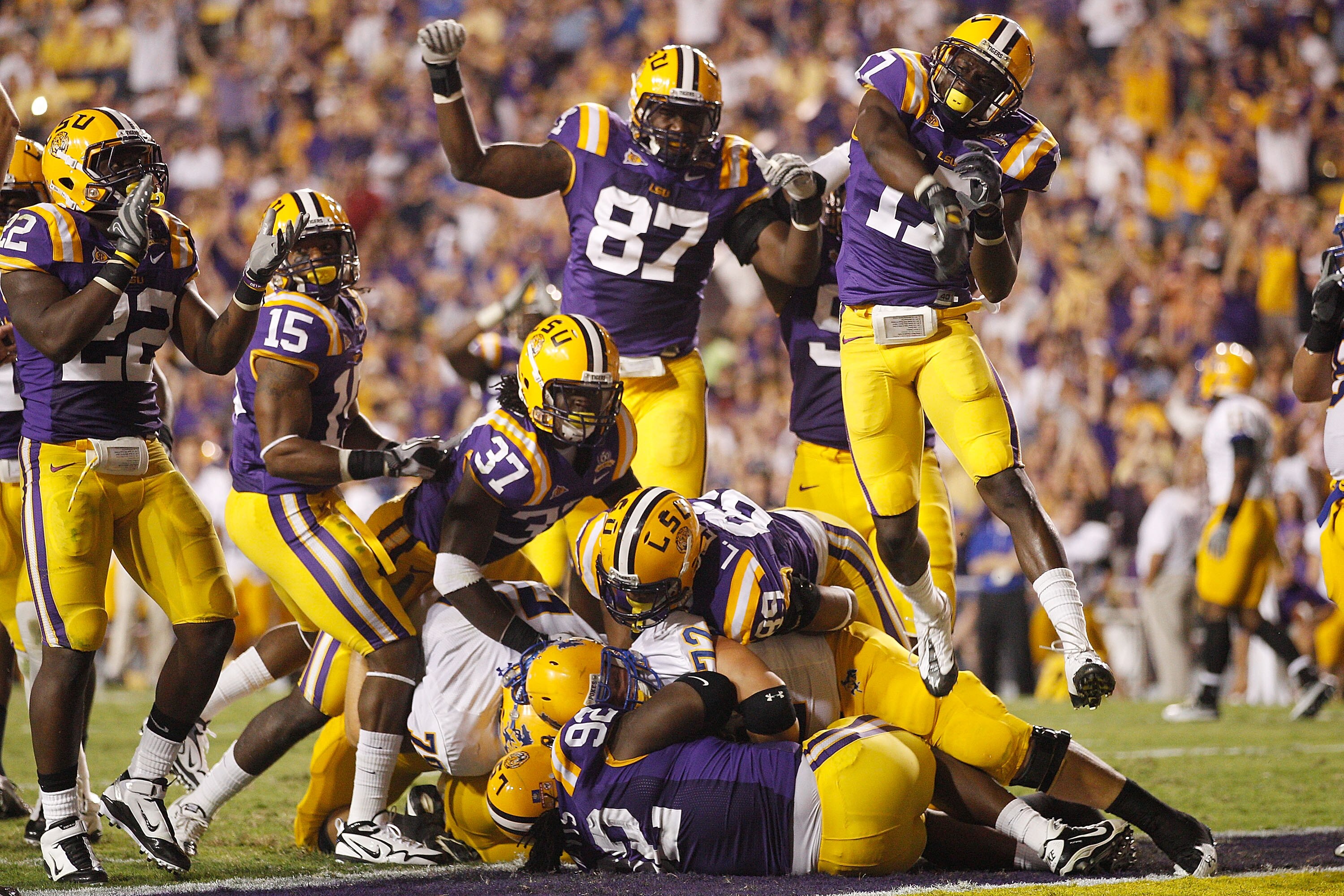 BATON ROUGE, LA - OCTOBER 16:  Drake Nevis #92  of the Louisiana State University Tigers tackles for a safety in the endzone Andre Anderson #22 of the McNeese State Cowboys at Tiger Stadium on October 16, 2010 in Baton Rouge, Louisiana.  (Photo by Chris G