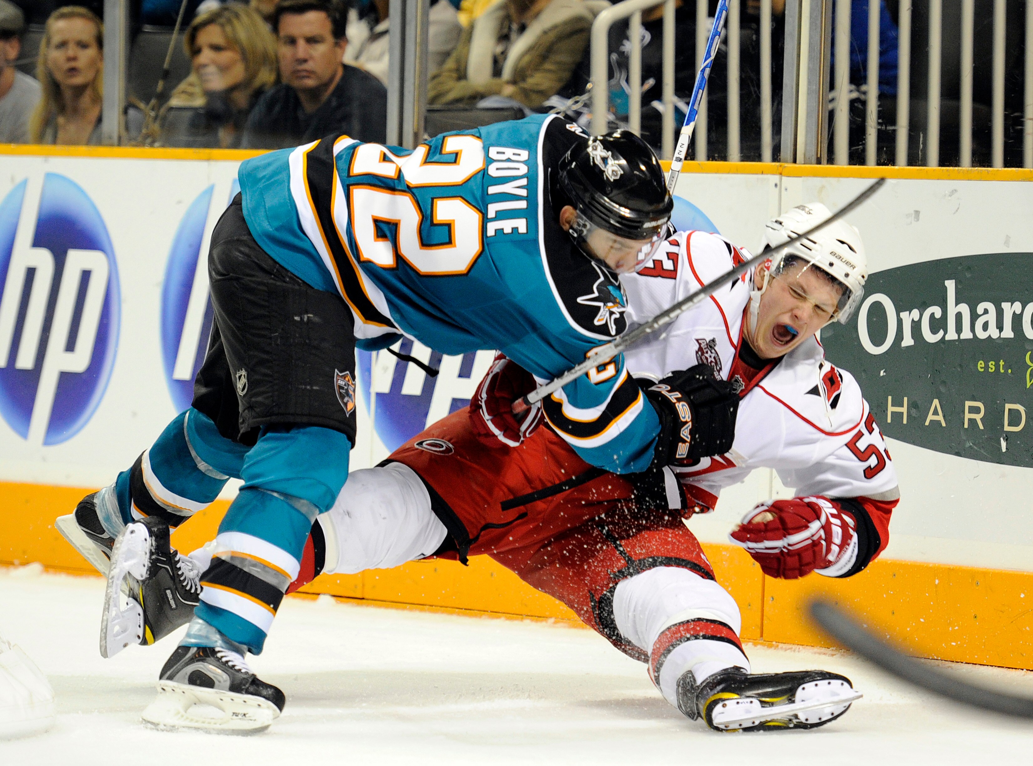 SAN JOSE, CA - OCTOBER 19: Jeff Skinner #53 of the Carolina Hurricanes checked hard to the ice by Dan Boyle #22 of the San Jose Sharks during an NHL hockey game at the HP Pavilion October 19, 2010 in San Jose, California. The Hurricanes won the game 5-2.