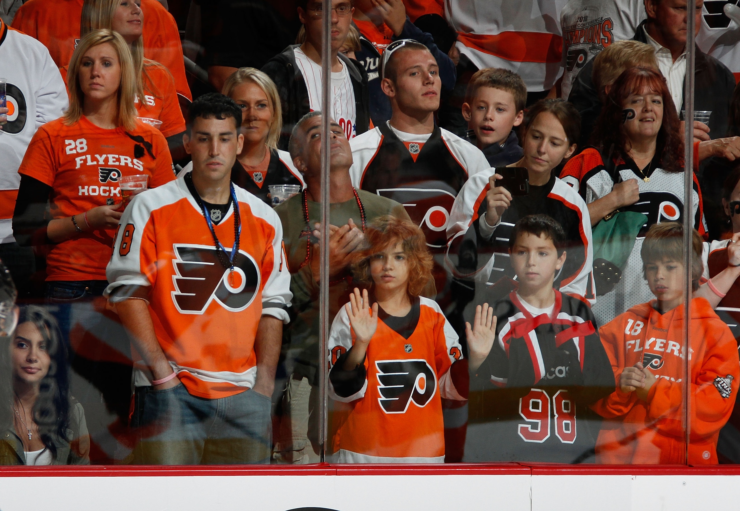 PHILADELPHIA - OCTOBER 11:  Fans look on as  players on the Philadelphia Flyers take  shots during warmups before a hockey game against the Colorado Avalanche at the Wells Fargo Center on October 11, 2010 in Philadelphia, Pennsylvania.  (Photo by Paul Ber
