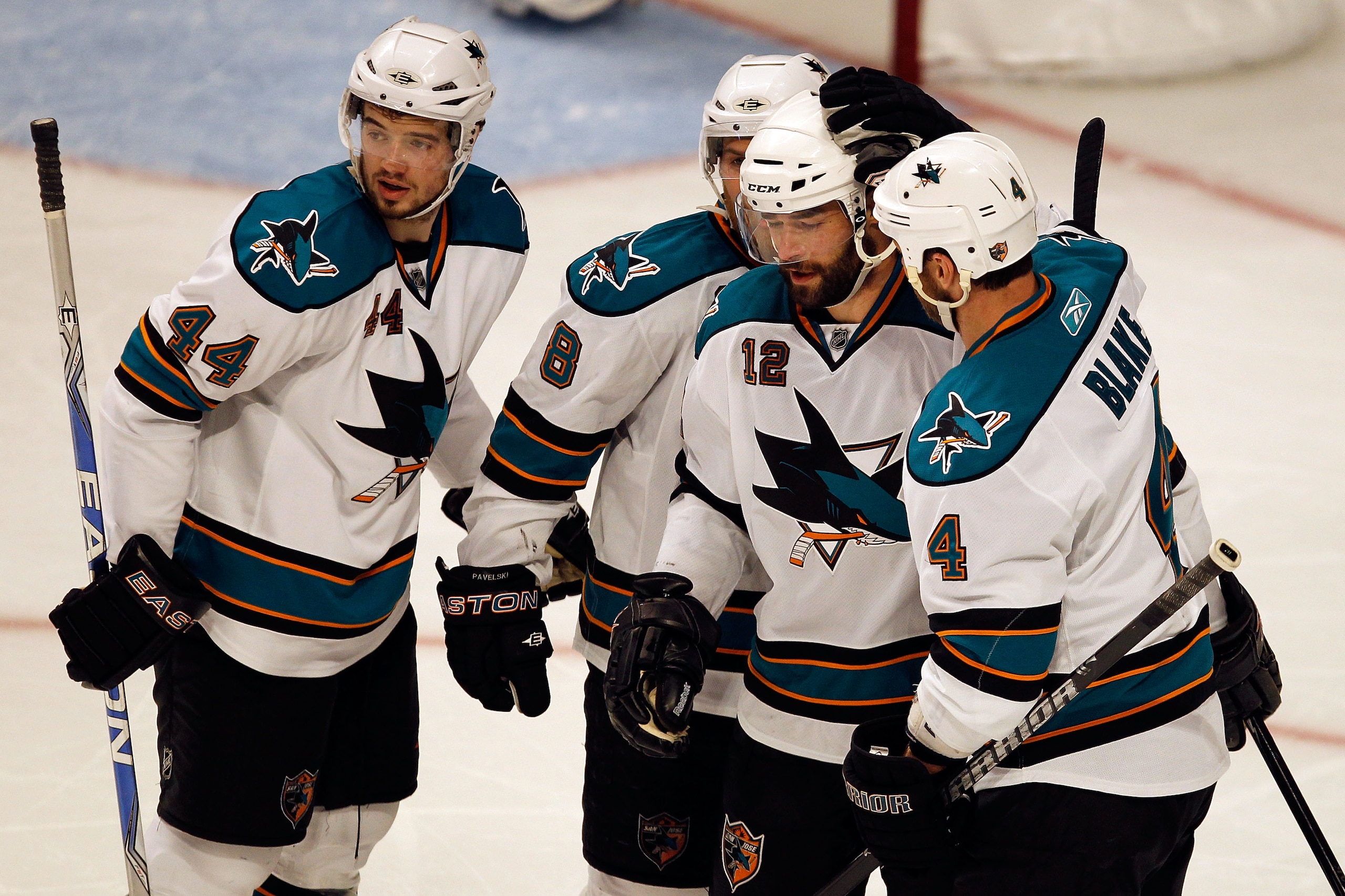 CHICAGO - MAY 23:  (2nd R) Patrick Marleau #12 of the San Jose Sharks celebrates his second period goal with teammates Marc-Edouard Vlasic #44, Joe Pavelski #8 and Rob Blake #4 while taking on the Chicago Blackhawks in Game Four of the Western Conference
