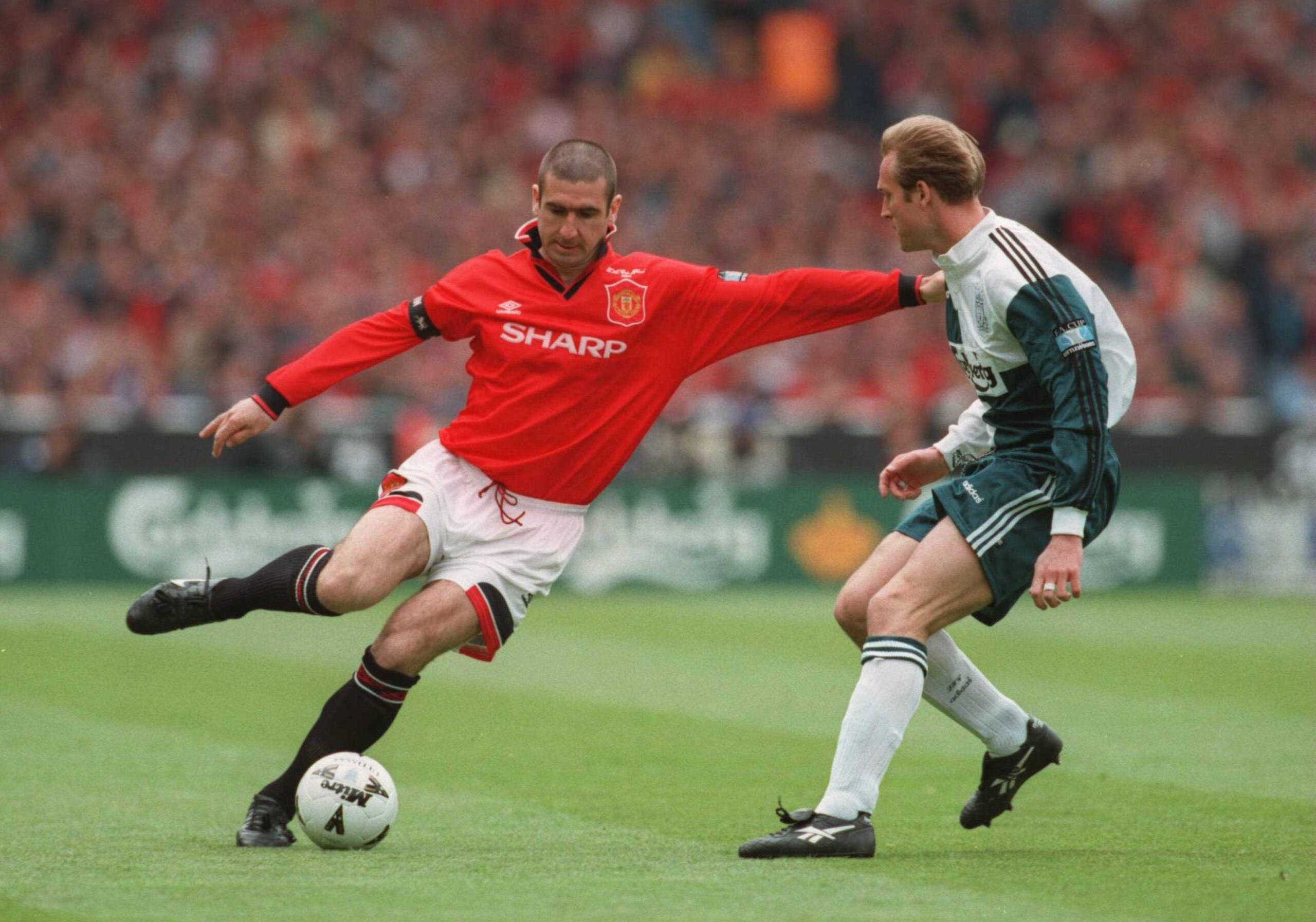 11 May 1996:  Eric Cantona of Man Utd goes past John Scales of Liverpool during the 1996 FA Cup Final between Manchester United v Liverpool at Wembley Stadium, London. Mandatory Credit: Clive Brunskill/ALLSPORT