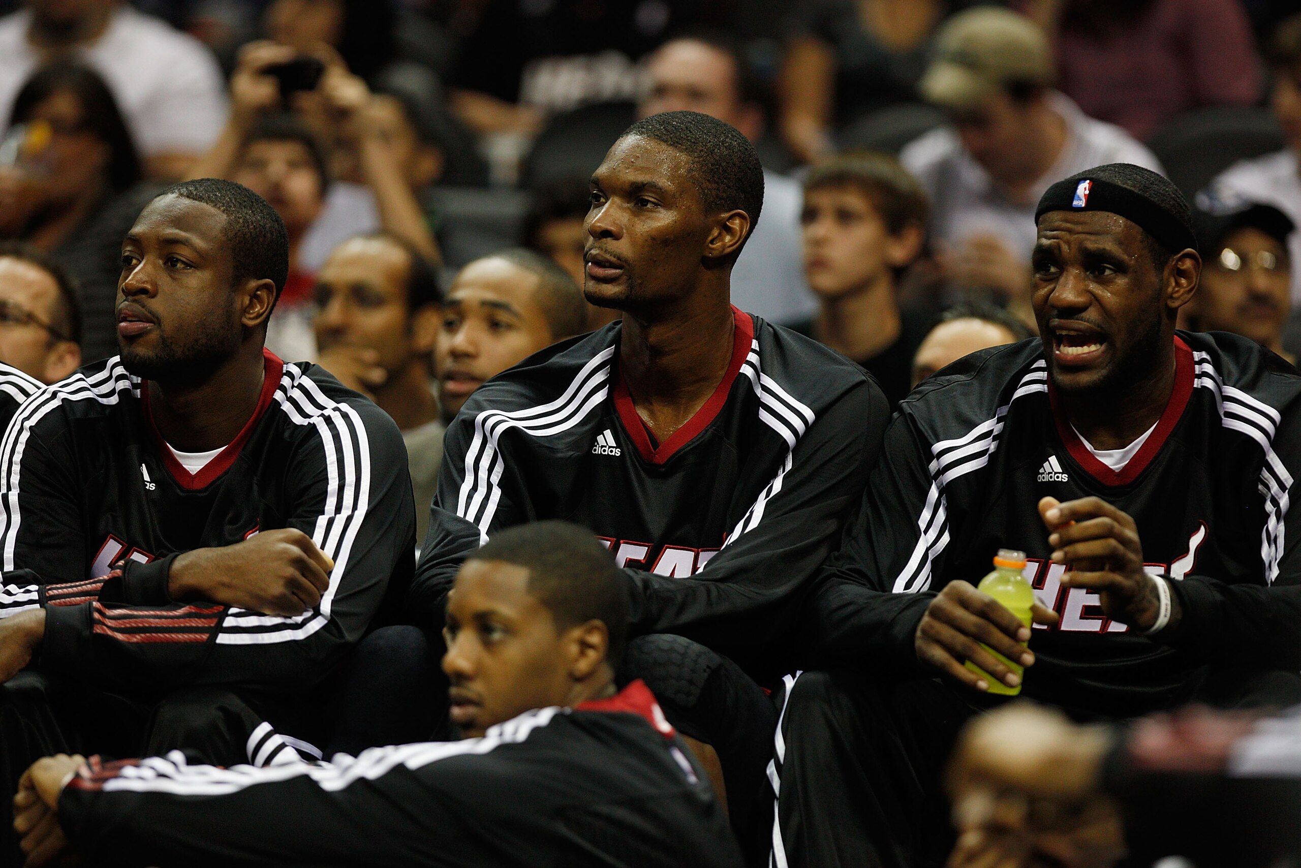 SAN ANTONIO - OCTOBER 09:  Dwayne Wade #3, Chris Bosh #1 and LeBron James #6 of the Miami Heat sit on the bench during the game against the San Antonio Spurs at the AT&T Center on October 9, 2010 in San Antonio, Texas.  NOTE TO USER: User expressly acknow