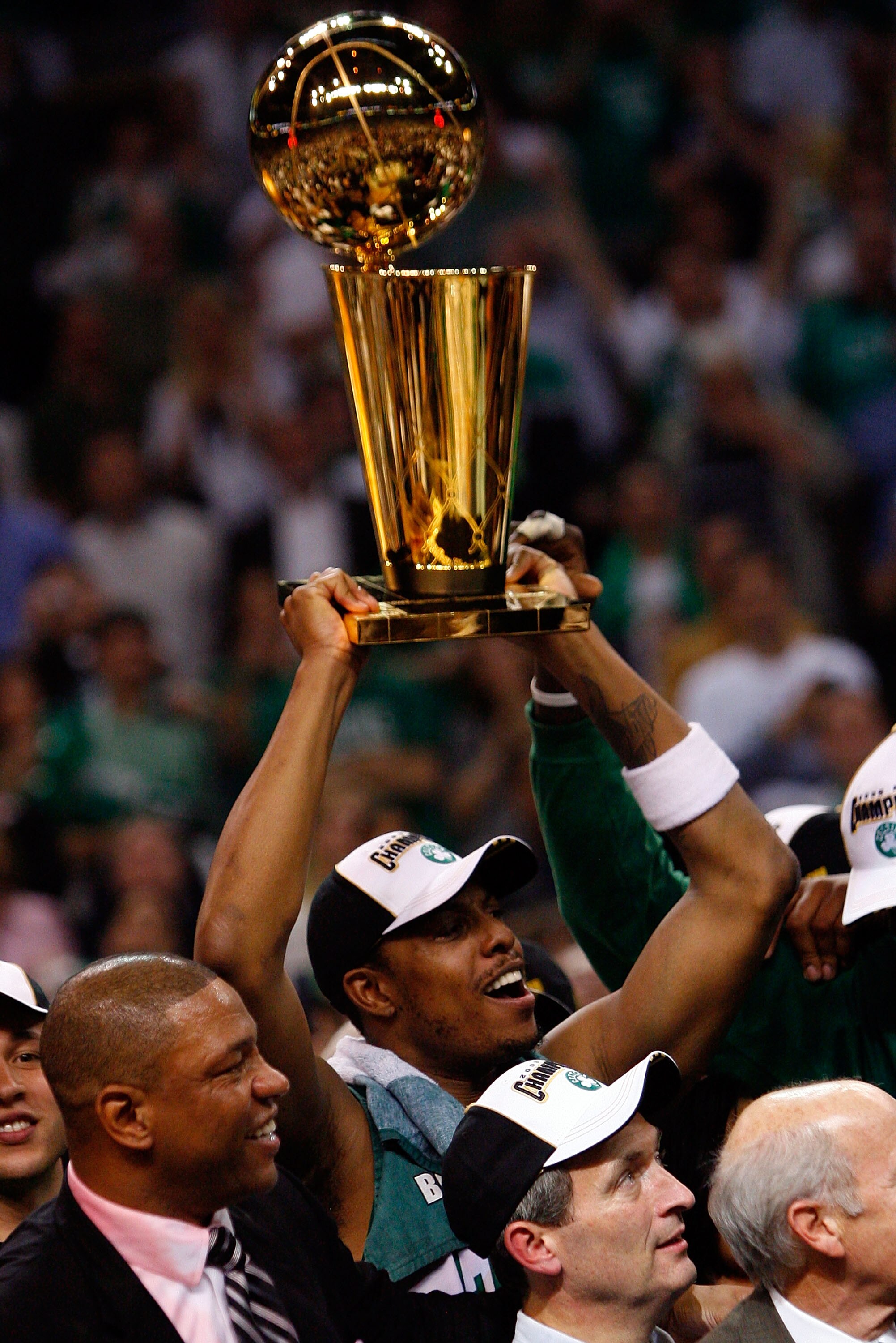 BOSTON - JUNE 17:  Paul Pierce #34 of the Boston Celtics holds up the Larry O'Brien trophy after Game Six of the 2008 NBA Finals against the Los Angeles Lakers on June 17, 2008 at TD Banknorth Garden in Boston, Massachusetts. The Celtics defeated the Lake