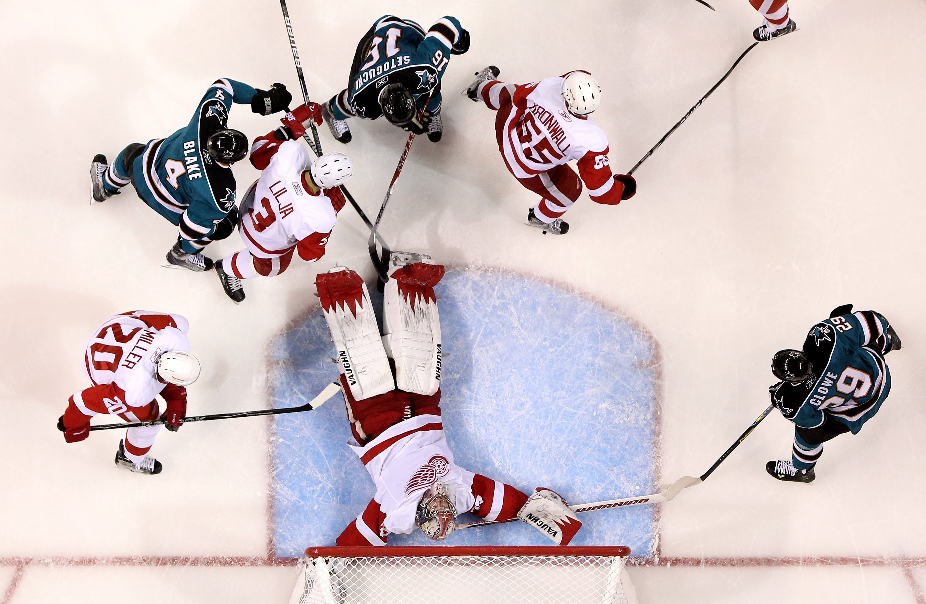 SAN JOSE, CA - MAY 02:  Jimmy Howard #35 of the Detroit Red Wings lies down on the ice to make a save during their game against the San Joses Sharks in Game Two of the Western Conference Semifinals during the 2010 NHL Stanley Cup Playoffs at HP Pavilion o